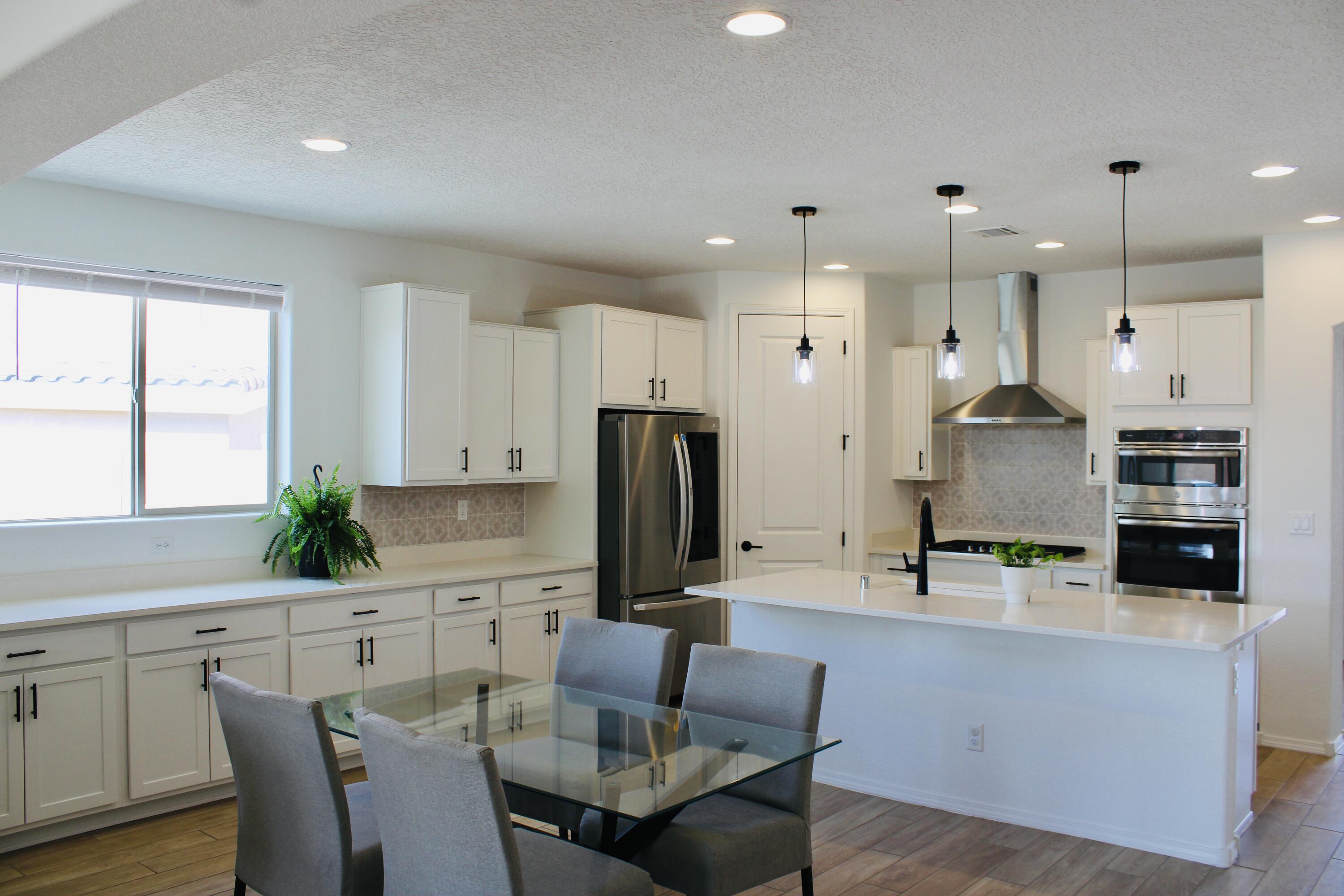 Welcome to this stunning, move-in-ready home offering 2,041 square feet of upgraded living space. The spacious open floor plan features a chef's kitchen with high-end appliances, a large island, and extended cabinetry. The master suite is a true retreat, with bay windows and a walk-in closet. Enjoy outdoor living with an extended covered patio, complete with a gas connection. Additional upgrades include epoxy-coated garage floors, pendant lighting, a widened driveway, tile floors, 8-foot doors, raised bathroom cabinets, and much more.