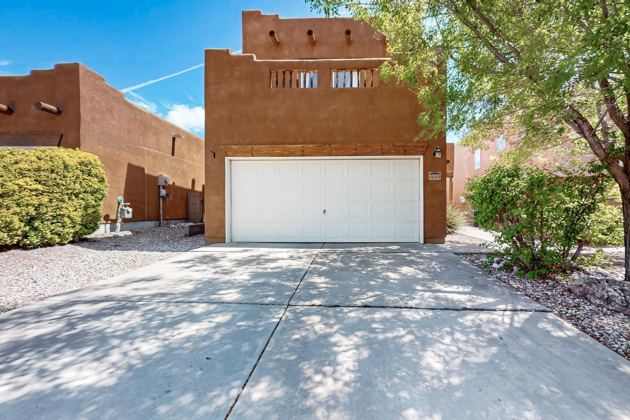 Welcome to Terracita - a quiet, gated community just minutes from Sandia Labs and Kirtland AFB. This bright and inviting home is ready for you to call it home. The kitchen has all stainless steel appliances, double oven, gas stove and new disposal. The living room has a gas kiva fireplace and mounted 65'' television that conveys. The spacious primary suite feels like an oasis with views of the Sandia Mountains. Both bathrooms have been tastefully updated with granite countertops, modern sinks and faucets, and light fixtures. The backyard has fruit trees, numerous native plants, and a small pond.New roof!! Installed April 2025 and has a 10 year transferrable warranty! All appliances​​‌​​​​‌​​‌‌​‌‌‌​​‌‌​‌‌‌​​‌‌​‌‌‌ convey.