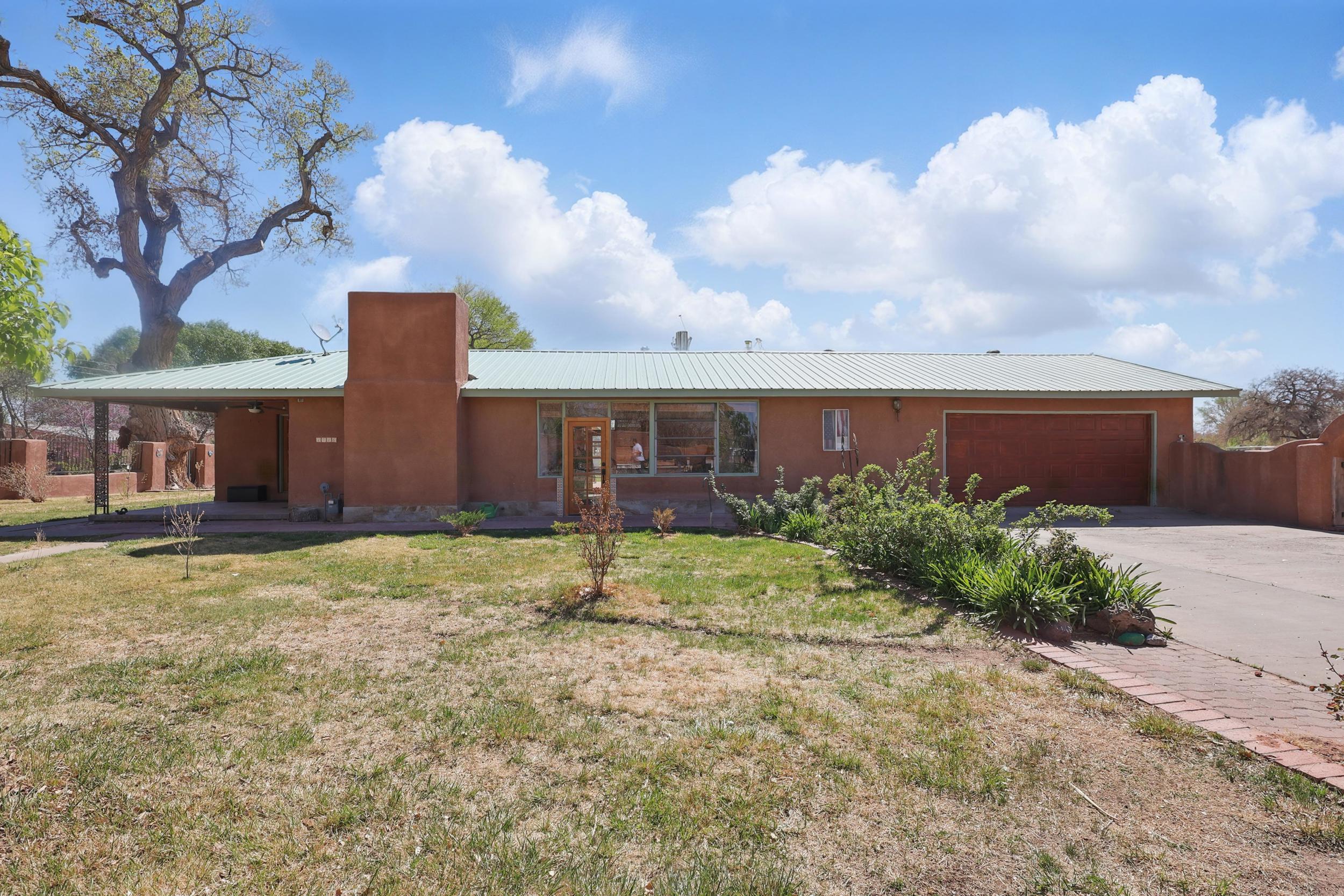 Rustic charm meets functional farm living on this mini farm with RGCD water rights and laser-leveled land. The 3-bed, 2-bath home features two cozy living areas, warm wood floors, a sunroom full of natural light, and a 2-car garage. Plenty of room for animals and growinga''bring your livestock, chickens, and garden plans. Property includes backyard access for RV or trailer, a bird roost, corral, hay storage, and a versatile storage area. A perfect spot for living close to the land with space to roam and grow.
