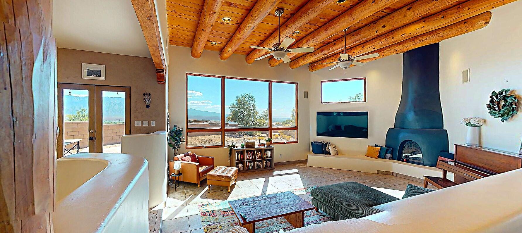 SW Luxury Living Where Style, Sustainability & Adventure Meet: Priced substantially below appraised value - Ask your Broker for more info.Step into this one-of-a-kind architectural masterpiece designed w/open floorplan that brings the breathtaking SW views into every corner of your home. Whether you're relaxing at the hearth of the kiva or cooking up something tasty in the kitchen, every angle connects you to something extraordinary.Surrounded by portals with beautiful tongue & groove ceilings, you'll discover multiple gathering spots ideal for morning coffee or evening cocktails. At the center of the home lies a private 600+ sq ft courtyard, an oasis perfect for anything from stargazing to sunbathing.Retreat to your luxurious master featuring a spa-style ensuite with..