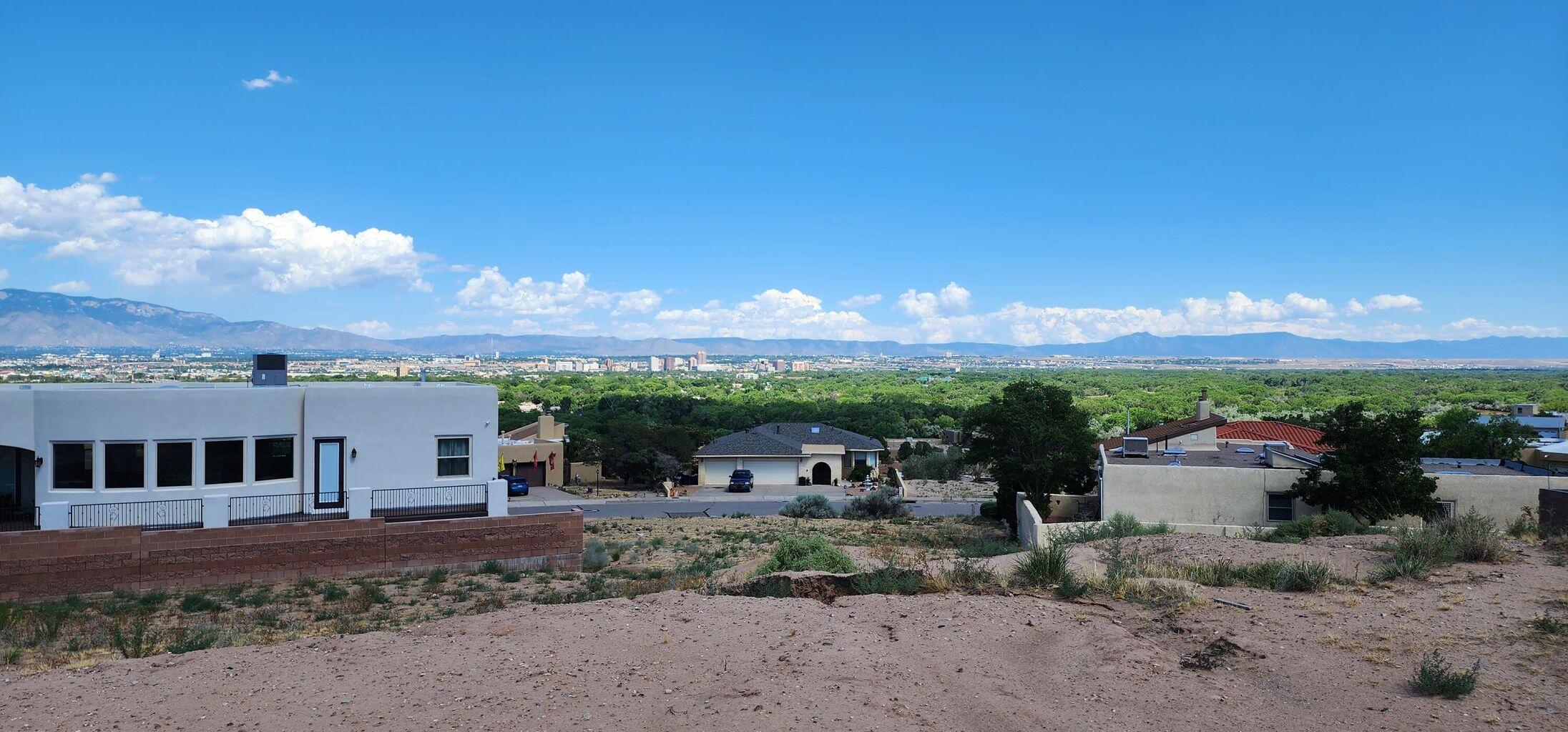 VIEWS, VIEWS, VIEWS! Build your dream home with unobstructed views of the city and mountains.