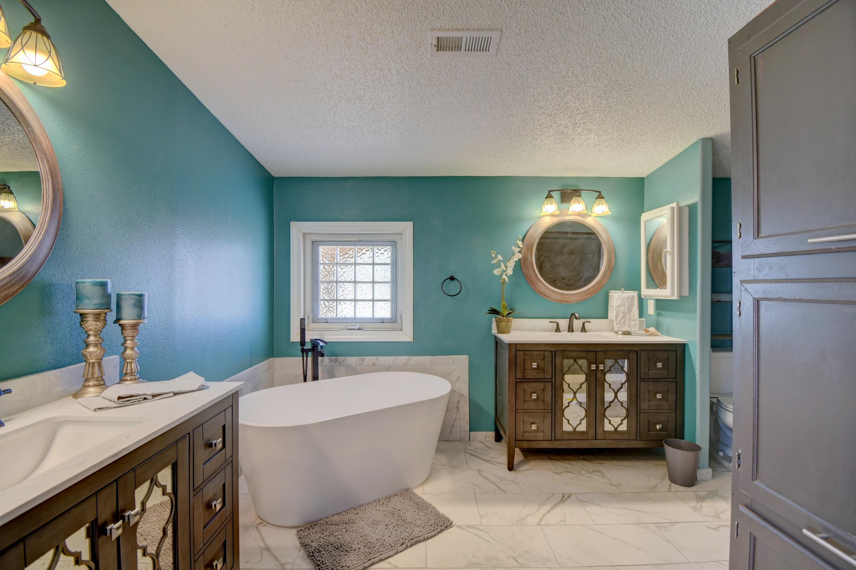 $10K Seller concession offered towards Buyer closing costs/prepaids. Seller will consider any & all offers! Rare find in the heart of Rio Rancho. Beautifully remodeled 4BR, 3BA home on 5-Acres, Zoned A-R. is Ideal for HORSES or other livestock, is on city water & natural gas & NEW septic. The open floorplan is ideal for multigenerational living. Enjoy the full-length covered portal, the updated kitchen w/granite counters, modern cabinets & ss appliances. The luxurious primary suite boasts dual sinks, a soaking tub, separate shower & a sitting room. Relax on the rear deck w/stunning views. Car enthusiasts & hobbyists will appreciate the enormous, metal workshop, separately metered & fully climate-controlled w/a wood stove & evaporate cooler-can fit up to 8 vehicles. Land can be subdivided!