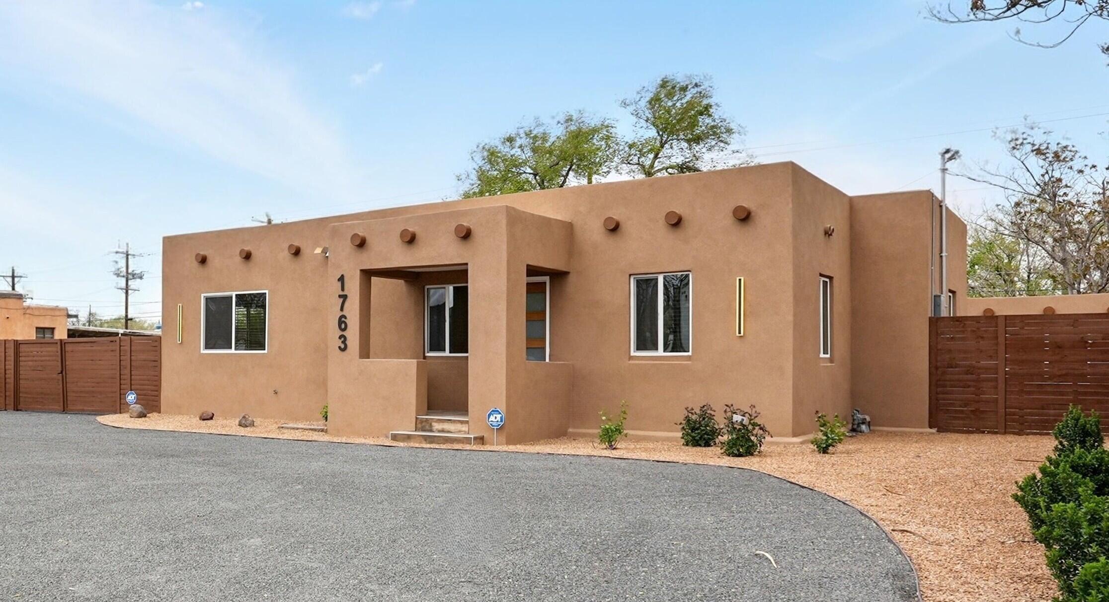 Beautifully renovated home on huge lot in heart of Albuquerque's historic North Valley. The perfect blend of old-world charm & modern sophistication in a stunning 1936 original adobe home. Oversized kitchen features huge 10ft x 6ft center island, modern appliances, additional prep sink, undercounter cooler, new custom-built hardwood cabinetry w/ample storage, undercabinet task lighting, & beautiful quartz counters. New TPO membrane roof, new thermal-pane windows, weatherproof synthetic stucco, new central A/C and HVAC. Two new baths feature new plumbing, fixtures, tile and lighting. X-large utility rm w/more storage. Includes private detached studio/flex space. Don't miss this opportunity to own a piece of history nestled between the Rio Grande and the Indian Cultural Center.