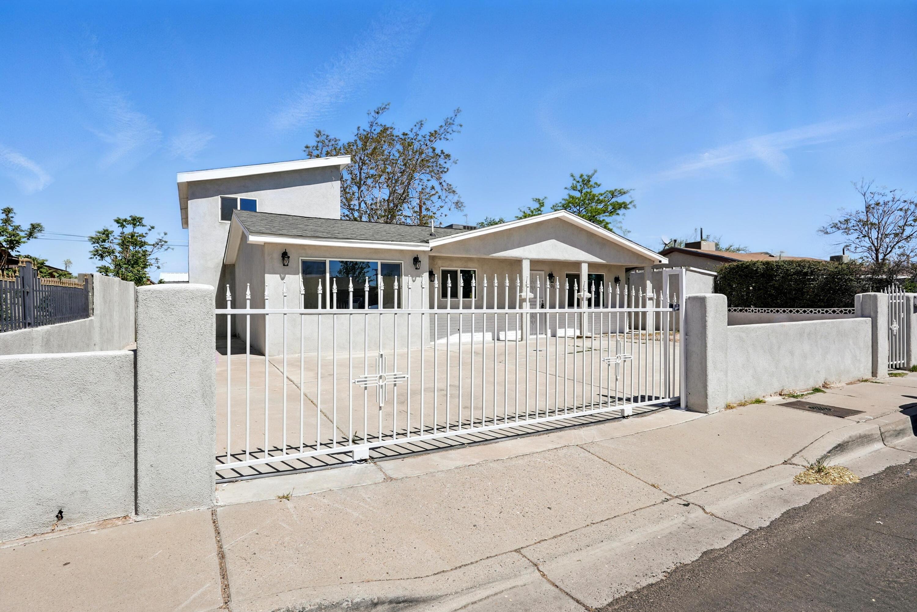 Welcome to this beautifully renovated 5 bedroom, 3 bathroom home. Step inside to find a completely updated kitchen with modern amenities and sleek fixtures, perfect for preparing gourmet meals or hosting friends and family. The bathrooms have also been recently remodeled, featuring stylish design elements and luxurious finishes. New flooring adds a touch of elegance throughout the house, creating a seamless flow from room to room. With plenty of square footage to spread out and relax in. Don't miss the chance to make this stunning property your own - schedule a showing today and experience the luxury living offered by this Albuquerque gem!