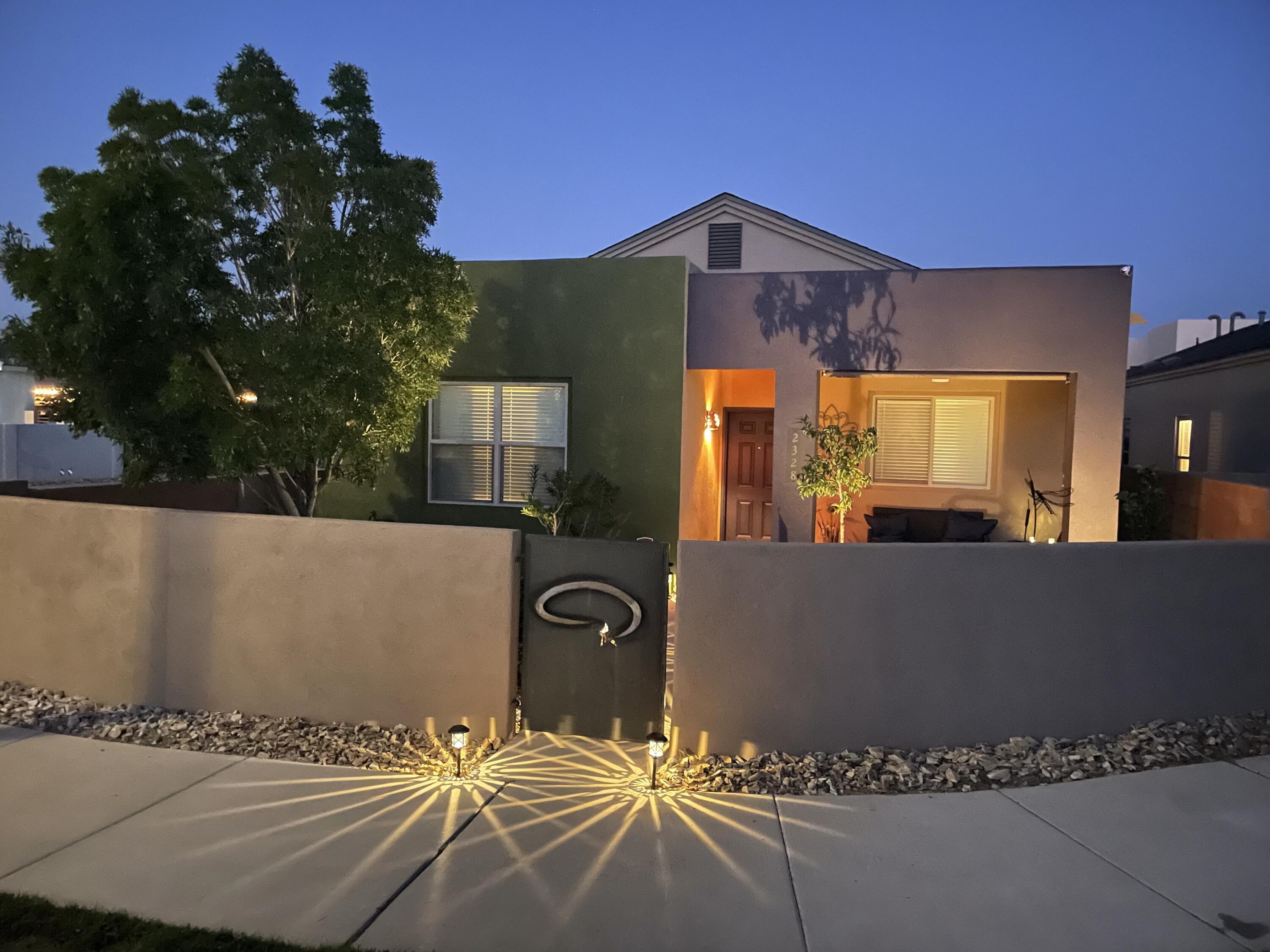 Welcome to modern living in this upgraded 3-bed, 2-bath home with a light-filled open floor plan and 2-car garage. Located on a quiet pocket park near the community pool, market, gym, and dining--where food trucks and live music often add to the charm. The upgraded kitchen features granite counters and stainless appliances. The private primary suite offers a large walk-in closet and ensuite with a deep soaking tub. Enjoy upgraded tile flooring in main areas and luxury carpet in bedrooms. Fully walled front and back yards--with a yummy peach tree, too! Mesa del Sol is a 12,900-acre master-planned community with parks, trails, and the acclaimed International School at Mesa del Sol (K-12). Easy access to UNM, Kirtland AFB, Netflix, and I-25.