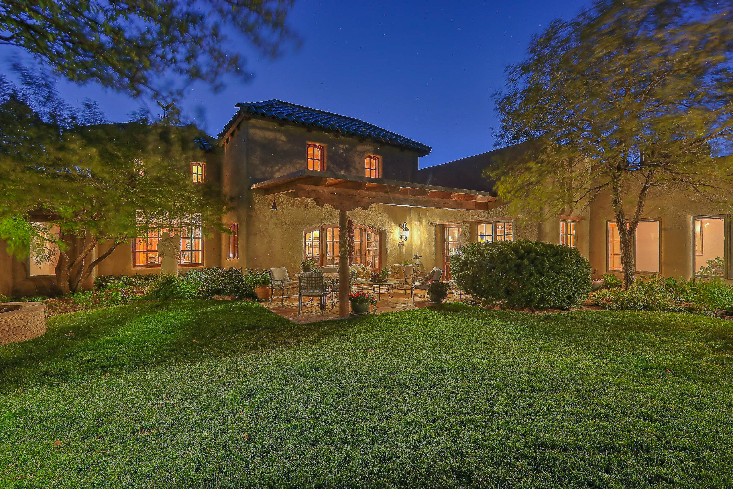 Come experience the luxury and craftsmanship of this custom John Calvin home!This stunning residence features two living areas, four spacious bedrooms and four and a half elegant bathrooms, a wince cellar, three car garage, and a swimming pool,offering both comfort and functionality. The gourmet chef's kitchen is a true centerpiece--perfect for entertaining or enjoying quiet family meals. Multiple patios and scenic view areas extend your living space outdoors, all set against the breathtaking backdrop of the majestic Sandia Mountains. Whether you're enjoying a morning coffee or hosting a sunset gathering, this home offers a unique blend of sophistication and natural beauty.
