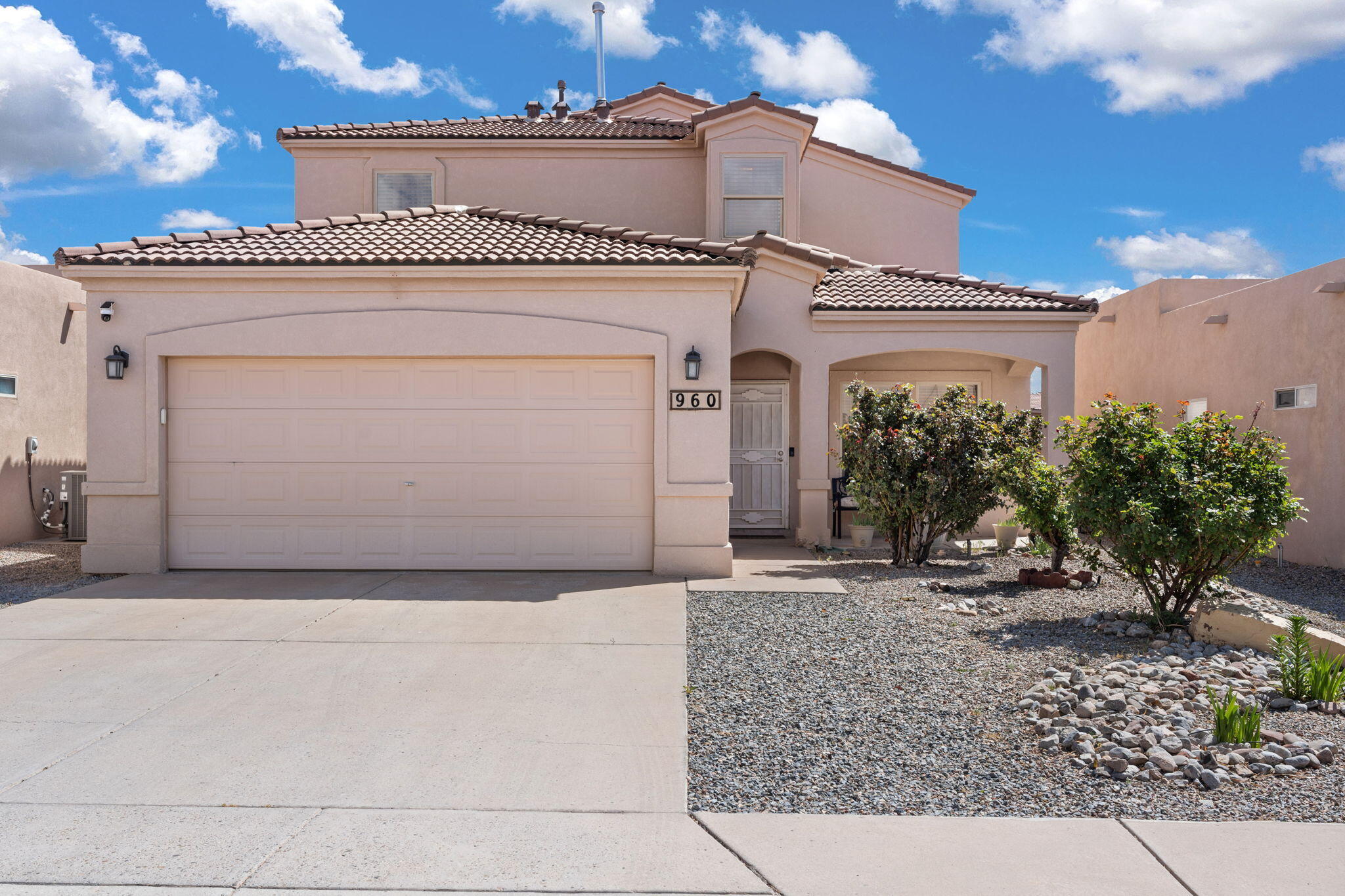 Welcome to this well-maintained 4-bedroom home in a quiet, friendly neighborhood near a park and trails. Step inside to find upgraded porcelain floors in the living and family rooms, carpet in the primary suite on the main floor, and two spacious living areas. The kitchen features a newly installed dishwasher and microwave, while the upstairs bath includes a glass sliding door. Enjoy comfort year-round with a 5-ton 17 SEER Heil HVAC system and a new water heater. The finished garage adds extra versatility, and the large open patio offers space to relax outdoors. Tile roof and thoughtful updates throughout!