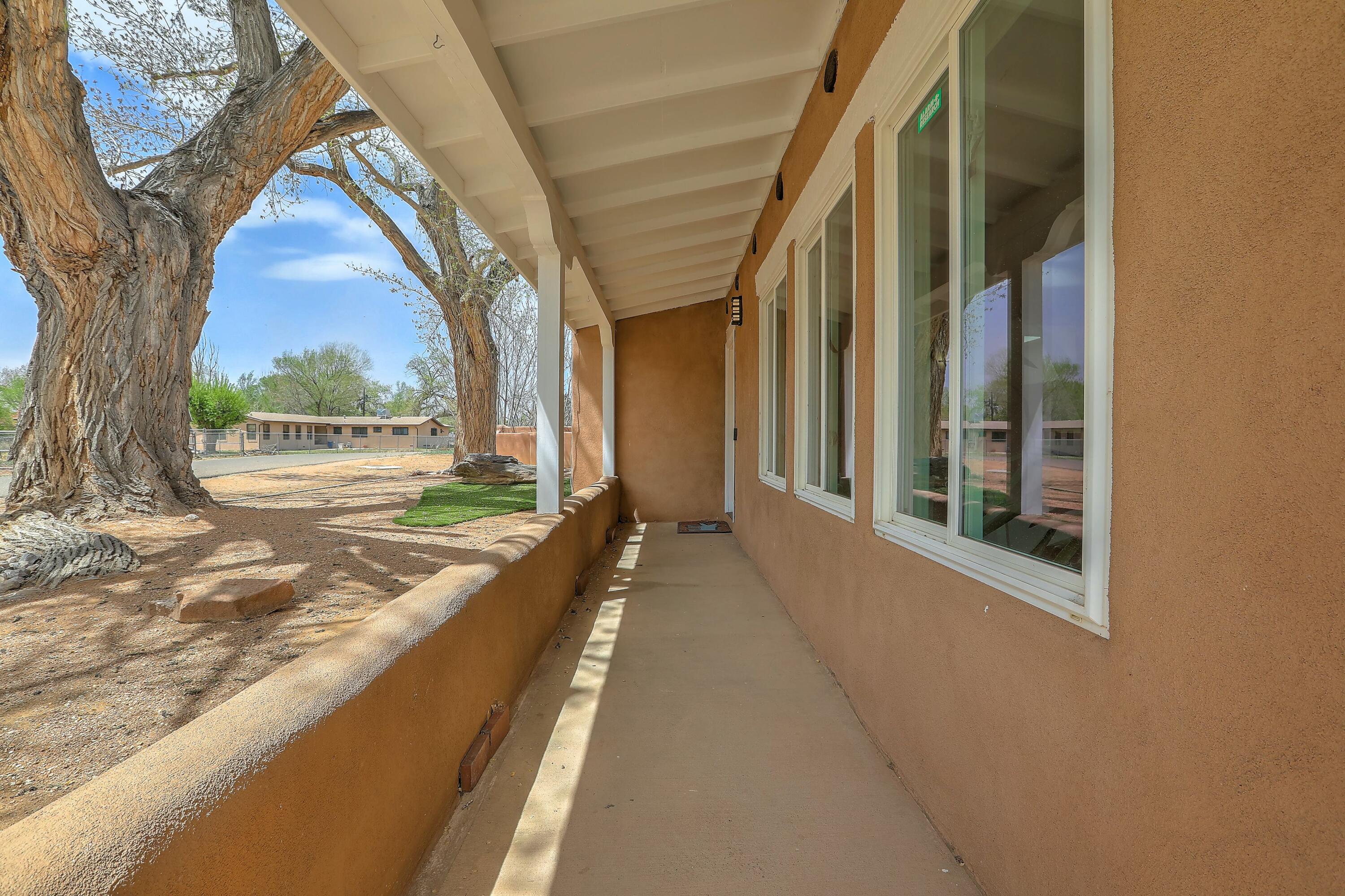 **Open House Saturday, May 3rd 11:00am-1:00pm** This beautiful North Valley property features 3 spacious bedrooms and 2 well-appointed bathrooms, perfect for comfortable family living. The home includes in-law quarters and a multifunctional 4-car detached garage, providing ample space for vehicles, hobbies, or storage. Enjoy the unique charm offered by brick floors and tongue and groove ceilings in the living and dining rooms that create a cozy atmosphere. Step outside to a covered porch that leads to a private backyard adorned with mature trees, perfect for outdoor relaxation. With nearby hiking trails and close access to shopping and dining options, this home offers an ideal balance of nature and convenience for all.