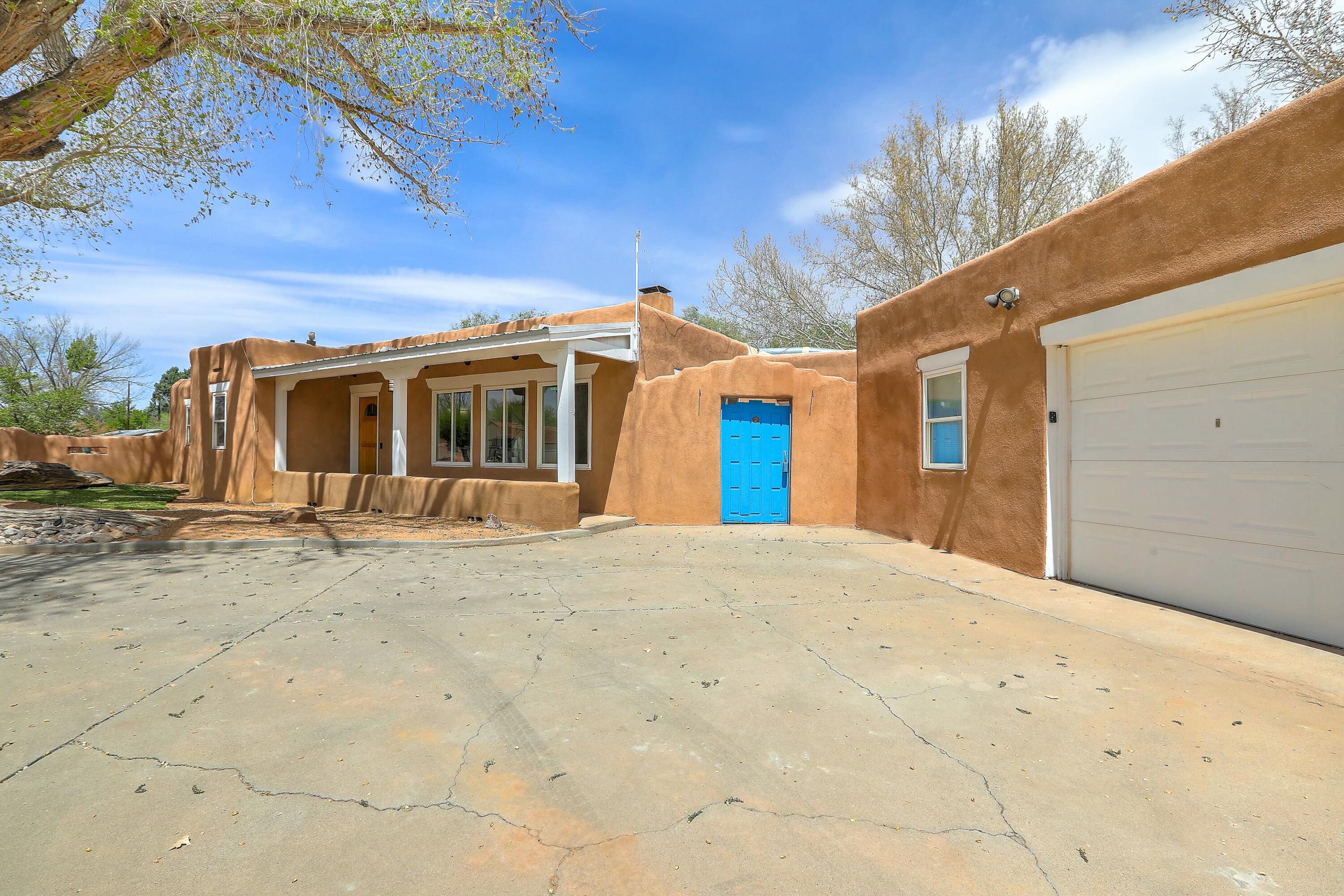 This beautiful North Valley property features 3 spacious bedrooms and 2 well-appointed bathrooms, perfect for comfortable family living. The home includes in-law quarters and a multifunctional 4-car detached garage, providing ample space for vehicles, hobbies, or storage. Enjoy the unique charm offered by brick floors and tongue and groove ceilings in the living and dining rooms that create a cozy atmosphere. Step outside to a covered porch that leads to a private backyard adorned with mature trees, perfect for outdoor relaxation. With nearby hiking trails and close access to shopping and dining options, this home offers an ideal balance of nature and convenience for all.