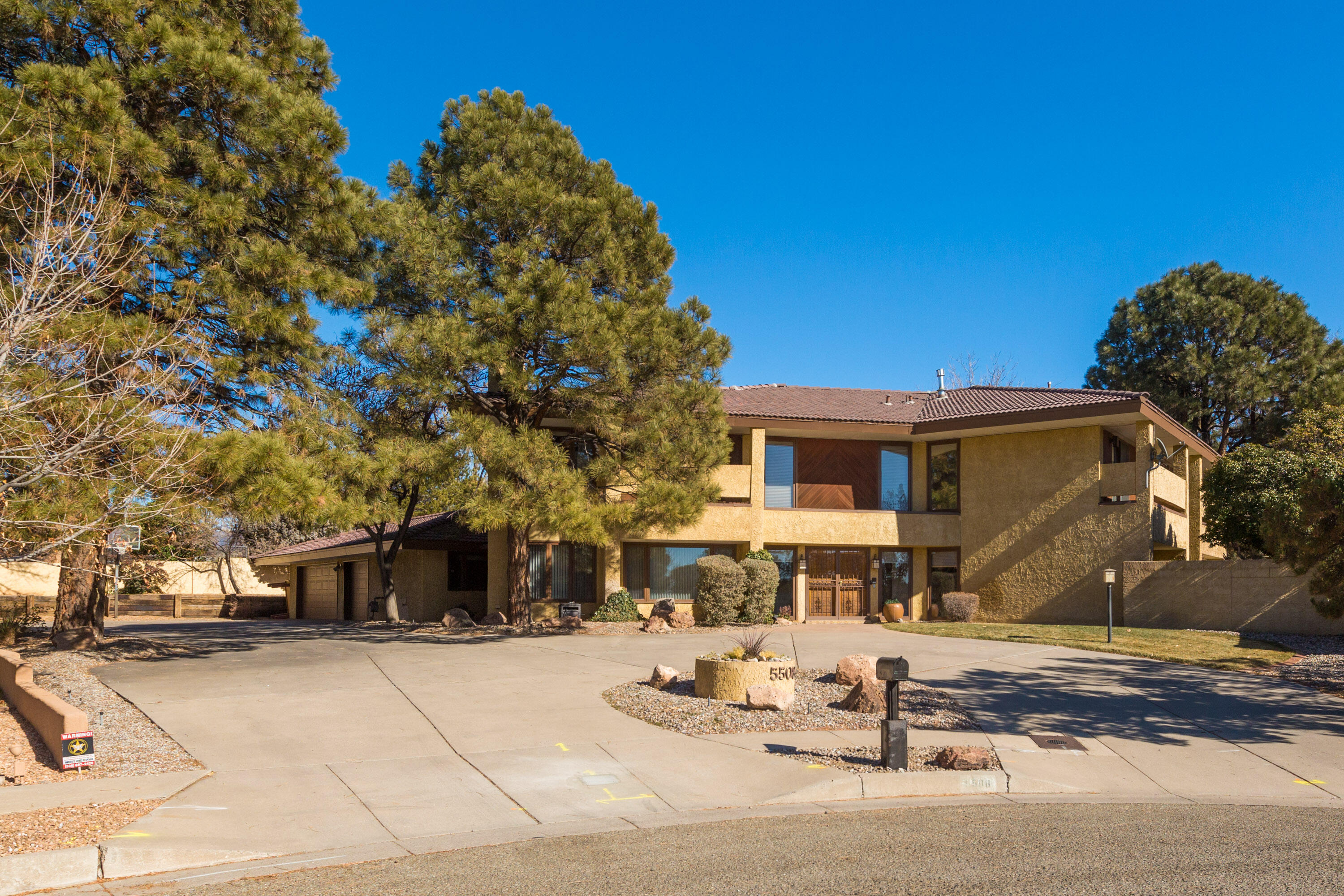 Beautiful cul-de-sac setting for this stately home on an enormous neighborhood lot. Swim in the pool, lounge on the patio, or dine in the fabulous cabana w/ wood burning fireplace. Gorgeous carved wood doors greet you as you enter this light filled home. Magnificent great room-lofty ceiling showcasing the artistic fireplace. Endless entertaining opportunities with full wet bar and open concept floorplan. Well-appointed kitchen featuring attractive custom flat front cabinets, solid surface counters, cozy breakfast nook, upgraded appliances, & large island with bar seating. Lower lever has a formal dining-cofferd ceiling, half bathroom, & is completed with possible in-law suite with full bath, bedroom and flex room (office space). Spacious primary suite with balcony, gas fireplace and...