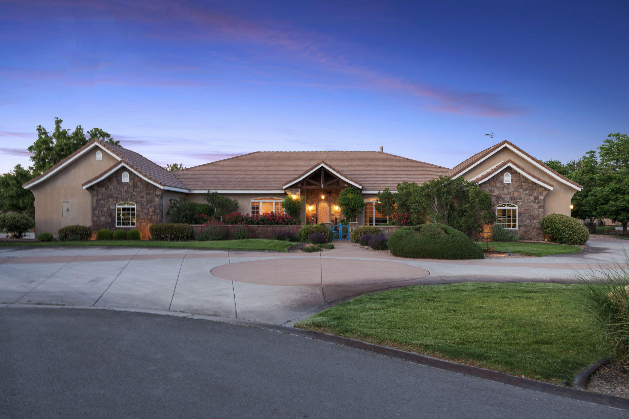Exquisite French Country-inspired custom home, nestled within the prestigious gated community of Los Poblanos Orchards in the heart of Los Ranchos. Spanning 4,691 square feet, this exquisite residence offers 4 spacious bedrooms, 3.5 luxurious bathrooms, and two inviting living areas and a 4 car garage. Stunning formal living with a truss beamed ceiling, built-ins, fireplace and a walls of glass doors showcasing the incredible views! Chefs kitchen with designer cabinetry, large island with prep sink, Wolfe appliances, butlers pantry and storage pantry! Formal dining space. Luxurious primary with a cozy fireplace and spa-like bath! Bath with jetted tub, walk-in shower and closet. Step outside to your private oasis: a heated pool, hot tub, outdoor kitchen & a beautifully landscaped backyard.