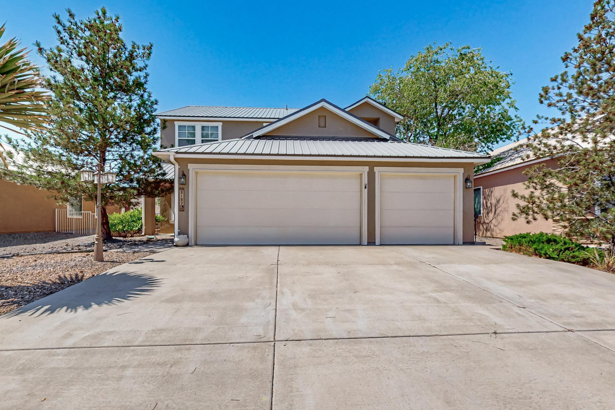This two story  Artistic built  home located  in Los Milagros Addition is ready to move in.  Easy to maintain landscaping front and back.  5 Bedroom 3 bath with   metal roofing. The  2 yr old Heating and  AC will keep you comfortable in any weather.  The open floor plan includes a spacious kitchen  with plenty of cabinet space that looks out to a family room with a gas fireplace.  Bring your clients today.