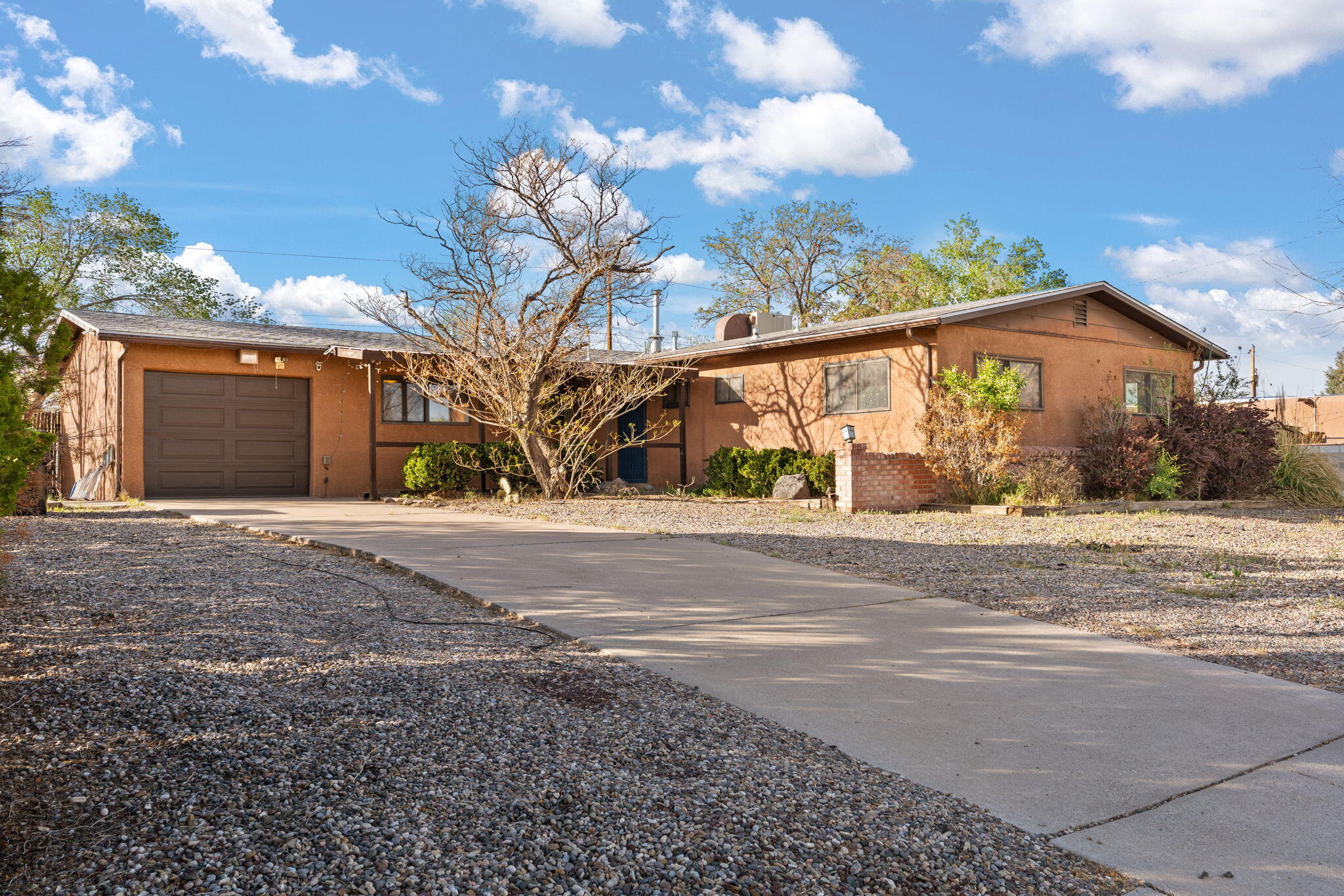 Welcome to a charming home in the desirable community! This spacious residence features an open floorplan with 3 bedrooms, 2 bathrooms, with Saltillo tile and brick everywhere except the bedrooms, and a 1-car garage. Nice sized living room has a built-in gas fireplace. Handmade kitchen cabinets with artistic punched copper inserts. The bonus room can be used as an office, media room, or man cave. Outdoors is a walled backyard with large covered patio and a dog run. Upgrades include added pantry, new water heater in January 2025, & new roof in 2018. Located near parks, shopping, and dining, this home offers both convenience and comfort. Don't miss your chance to own this gem--schedule your showing today!