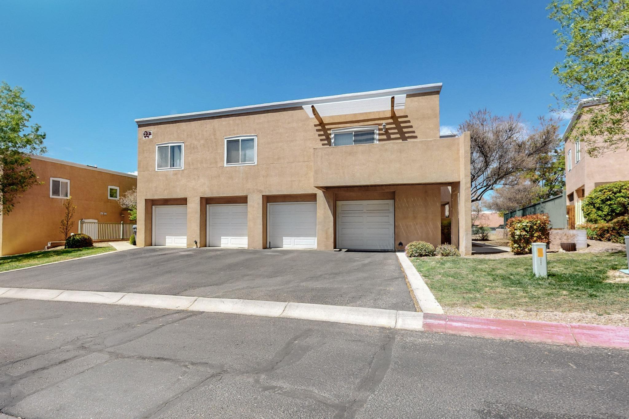 Welcome to this inviting larger 2-bedroom home located in the great Oso Park gated community. You'll love the spacious open living room with fireplace.  The kitchen comes complete with necessary major appliances, including microwave and the laundry room has a washer and dryer. There is a very large master bedroom upstairs, a half bath downstairs for guests and the family bath has double sinks.  Take advantage of the private courtyard featuring a covered patio and the 1-car garage equipped with an opener.  This home offers a blend of comfort and practicality.  Close to restaurants, shopping, CNM and El Oso Grande Park.  There is plenty of guest parking too.  Water, sewer and trash are covered by the HOA fees in addition to landscaping, stucco, roof, streets, gates and lights..