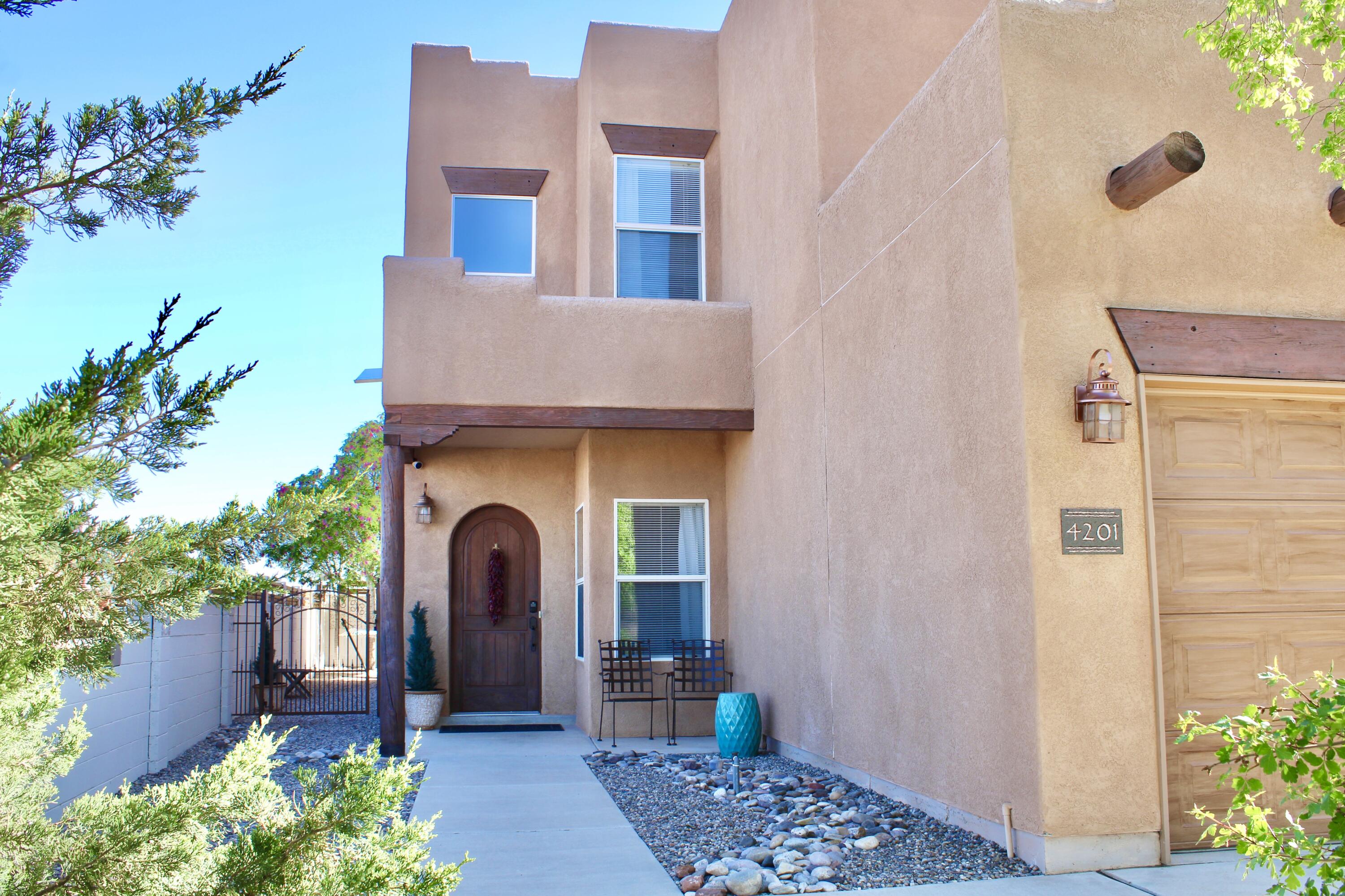 Welcome to your new home in the heart of Desert Ridge, one of Rio Rancho's most sought-after neighborhoods. This beautifully maintained two-story offers 5 bedrooms--or 4 plus a cozy home office--giving you plenty of space to live, work, and grow. Step into the open-concept living area, where the kitchen invites gatherings with bar seating, stunning Silestone countertops, and modern stainless steel appliances. Fresh new carpet adds comfort underfoot, while the brand-new TPO roof brings peace of mind. The clean, epoxy-coated garage floor is the perfect finishing touch. Outside, enjoy a low-maintenance backyard--ideal for relaxing or entertaining without the upkeep. Located just minutes from Intel, schools, parks, and shopping, this warm and welcoming home truly has it all. Move-in ready!!