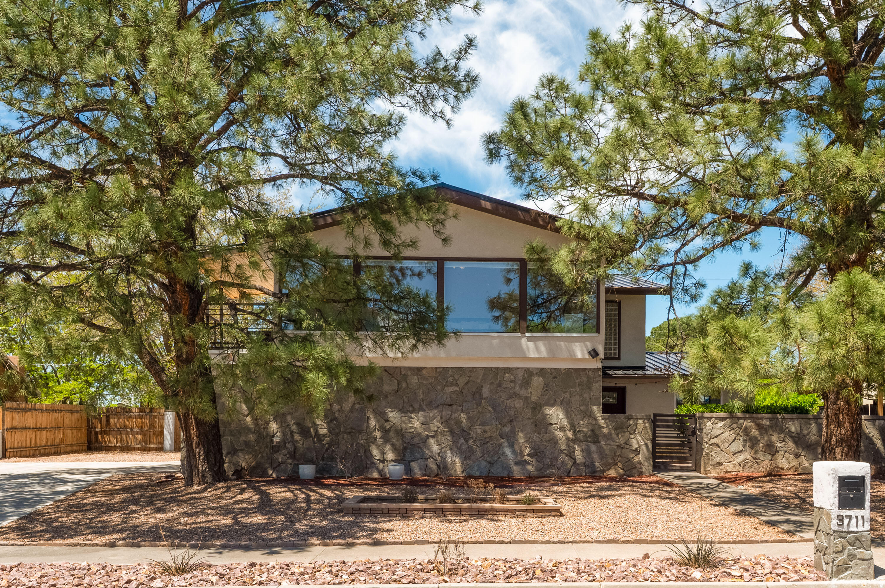 Spacious and versatile, this stunning two-story home in the sought-after Eldorado School District features 5 bedrooms and 3 bathrooms, offering plenty of space for family, guests, or a home office setup.  Enjoy the convenience of a primary suite on the main floor and a master retreat upstairs with breathtaking mountain views.  The kitchen is equipped with stainless steel appliances and granite counters.  There are two separate living areas which are perfect for entertaining or relaxing.  Step outside to a private courtyard and a large backyard with a covered patio.  There is even parking for an RV!  Don't miss the opportunity to call this home your own.