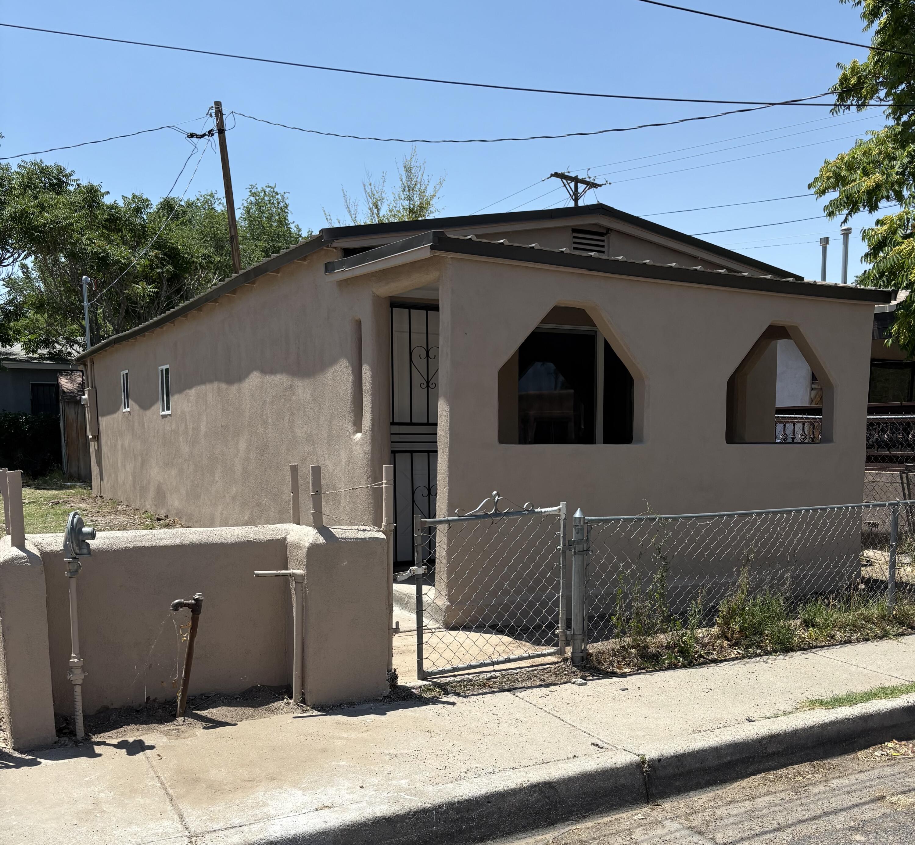 INVESTORS - ACT NOW BEFORE IT IS TOO LATE. YOUR IMAGINATION AND SWEAT EQUITY - this could be your last chance before the seller takes it to completion! See the before and after pictures.  Walls repaired, textured and freshly painted throughout.  New Beautiful flooring.  Kitchen cabinets installed.  Fresh Stucco, new windows and new custom color Metal roof.  Electricty is upgraded with brand new panel and 200 amp service.  Water is connected.  Are you ready to take on a promising project to the finish line? This little jewel just needs final touches to make this wee house a special home. Located in the Heart of Barelas. Easy access to Downtown, ABQ BioPark Zoo, UNM, and National Hispano Cultural Center. There are three parcels  featuring 2 addresses 820 Lewis and 822 Lewis