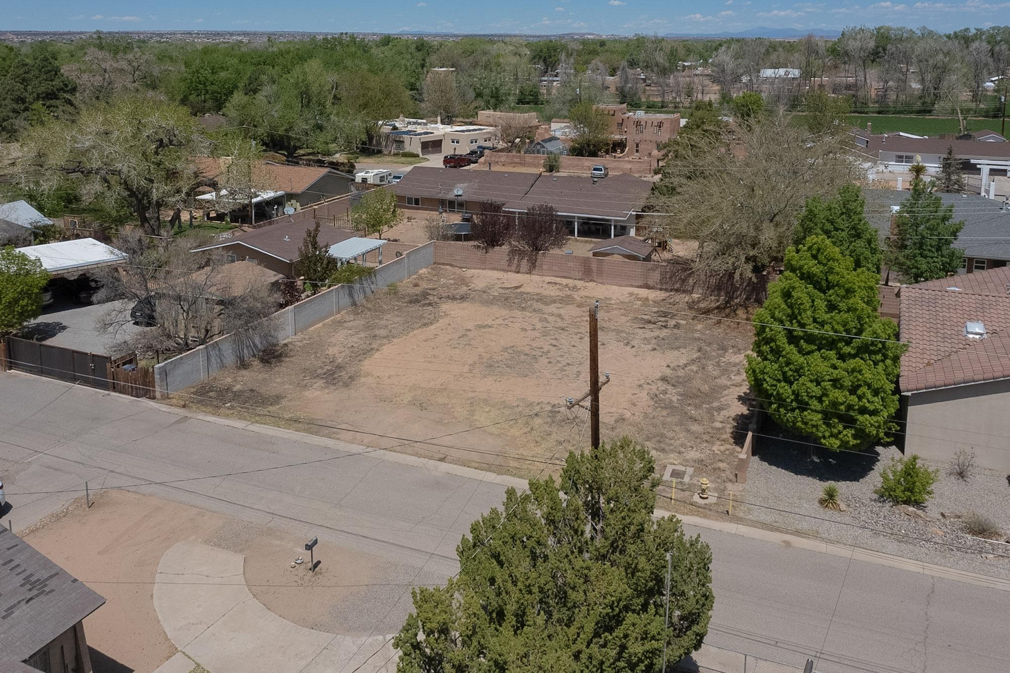 Here is your opportunity to design and build your dream home in the heart of the North Valley. This .18-acre lot is a blank canvas and ready for a custom build that suits your lifestyle. Experience the unique charm of this exceptional area--home to the Los Poblanos Inn & Organic Farm, Casa Rondena Winery, and scenic Rio Grande Bosque and nearby trails. Enjoy a peaceful, country-like setting with mature trees and quiet streets, all while being just minutes from city conveniences, dining, and shopping. Call today and take the first step in building in a community celebrated for its natural beauty, rich character, and tranquil atmosphere.