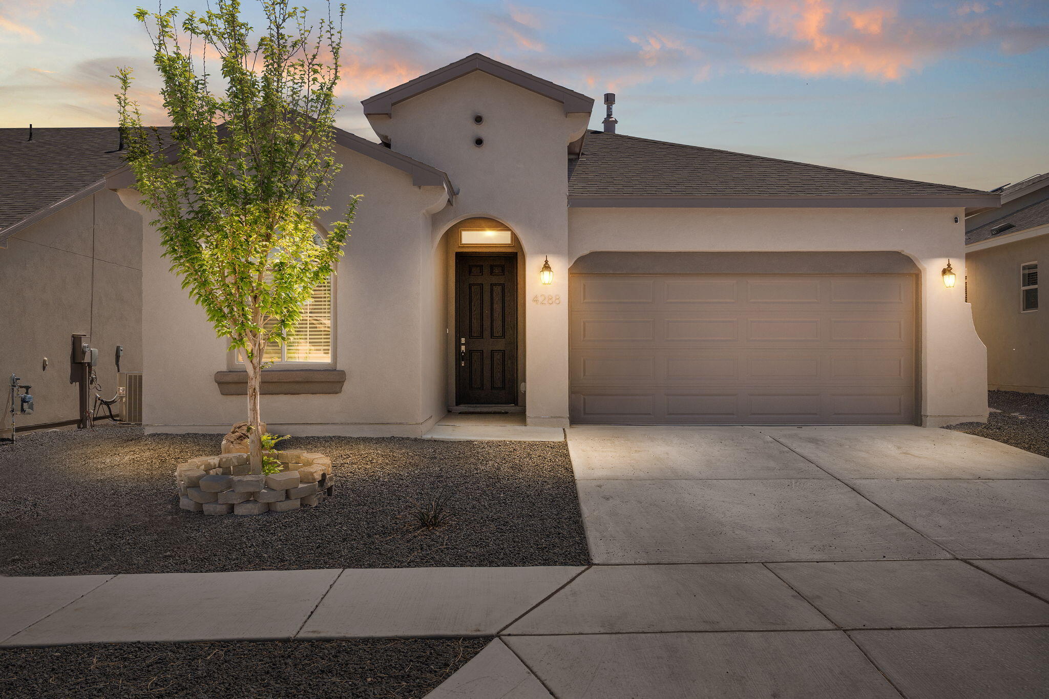 Welcome to this stunning 5 bedroom, 3 full-bathroom Hakes Brothers home offering so much space! Soaring ceilings, beautiful lighting and upgrades throughout with a breathtaking open floor plan perfect for bringing everyone together! Enjoy entertaining in the cook's kitchen with stainless steel appliances, beautiful granite countertops, pantry, gas stove, farmhouse sink, and a bar area to sit together. Getaway to your large master bedroom and relax in the master bath featuring a large walk-in closet, and walk-in shower that has dual shower heads including a rainfall.  Energy efficient! Built to a certified BuildGreen NM Silver! Fireplace, central air, covered patio, tankless water heater with recirculating pump, programmable irrigation, you must see this home!!