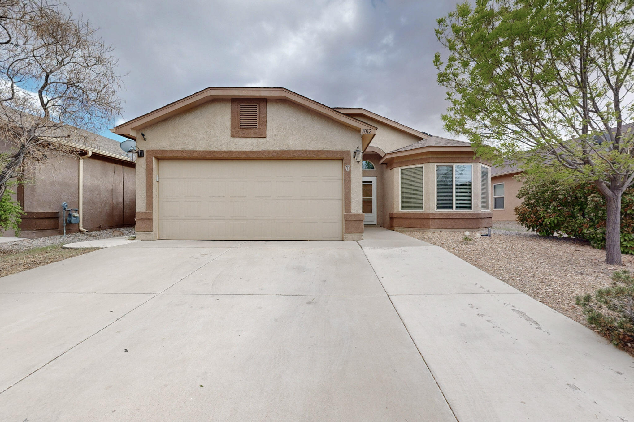 Take a look at this stylish and move-in ready 3-bedroom, 2-bath home nestled in Albuquerque's desirable Ventana Ranch. This single-story gem boasts vaulted ceilings, tons of natural light, and a spacious living area. The kitchen features maple cabinetry, beautiful backsplash and a breakfast nook, while the primary suite includes a walk-in closet and private bath. Outside, enjoy a low-maintenance super large xeriscaped yard that features a pergola perfect for entertaining, BBQ's and family events, plus there is a huge park right outside of your backyard. This wonderful home is minutes away from shopping, dining. Make your appointment today to see your new home!