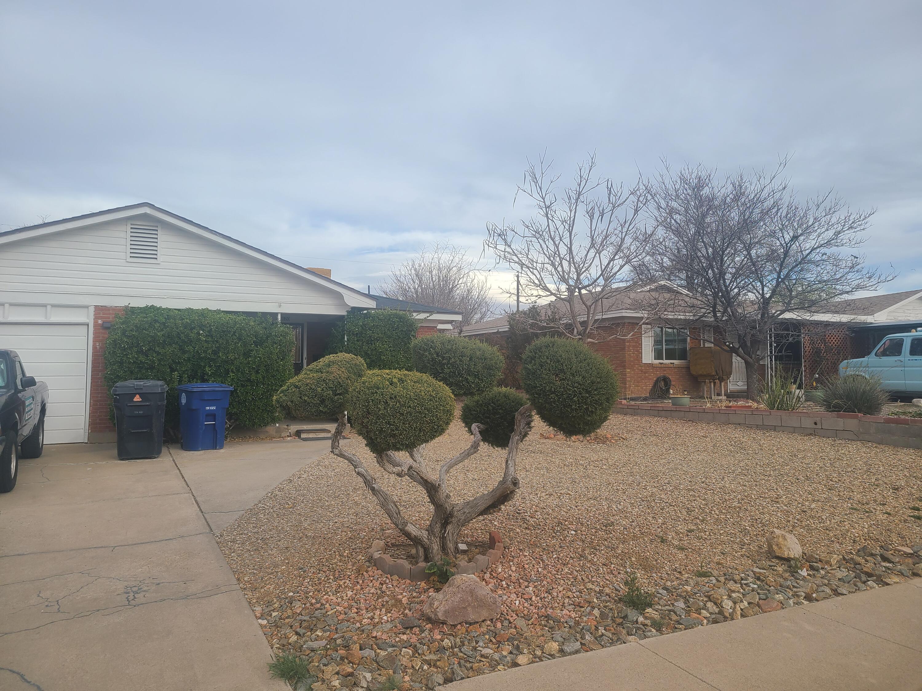 Nestled in the heart of ABQ's SE Heights, this charming SFR features a low-maintenance, fully xeriscaped yard w/a spacious, private backyard featuring fruit trees (cherry, peach, pear), a grill, swings, and a garden area -- perfect for relaxing or entertaining. Energy efficiency, fully-owned solar panels generate summer credits to offset winter electricity costs, making this home truly budget-friendly. Appliances convey w/sale. Recent upgrades include a new swamp cooler motor (2024), refinished hardwood floors, new luxury vinyl flooring in the bathrooms, and a completely redone shower in the PB. A perfect starter home or a cozy downsizing option, this property is a must-see. Conveniently located near KAFB, major hospitals, & only 7 min. from the freeway, Uptown, and malls. Don't miss out!