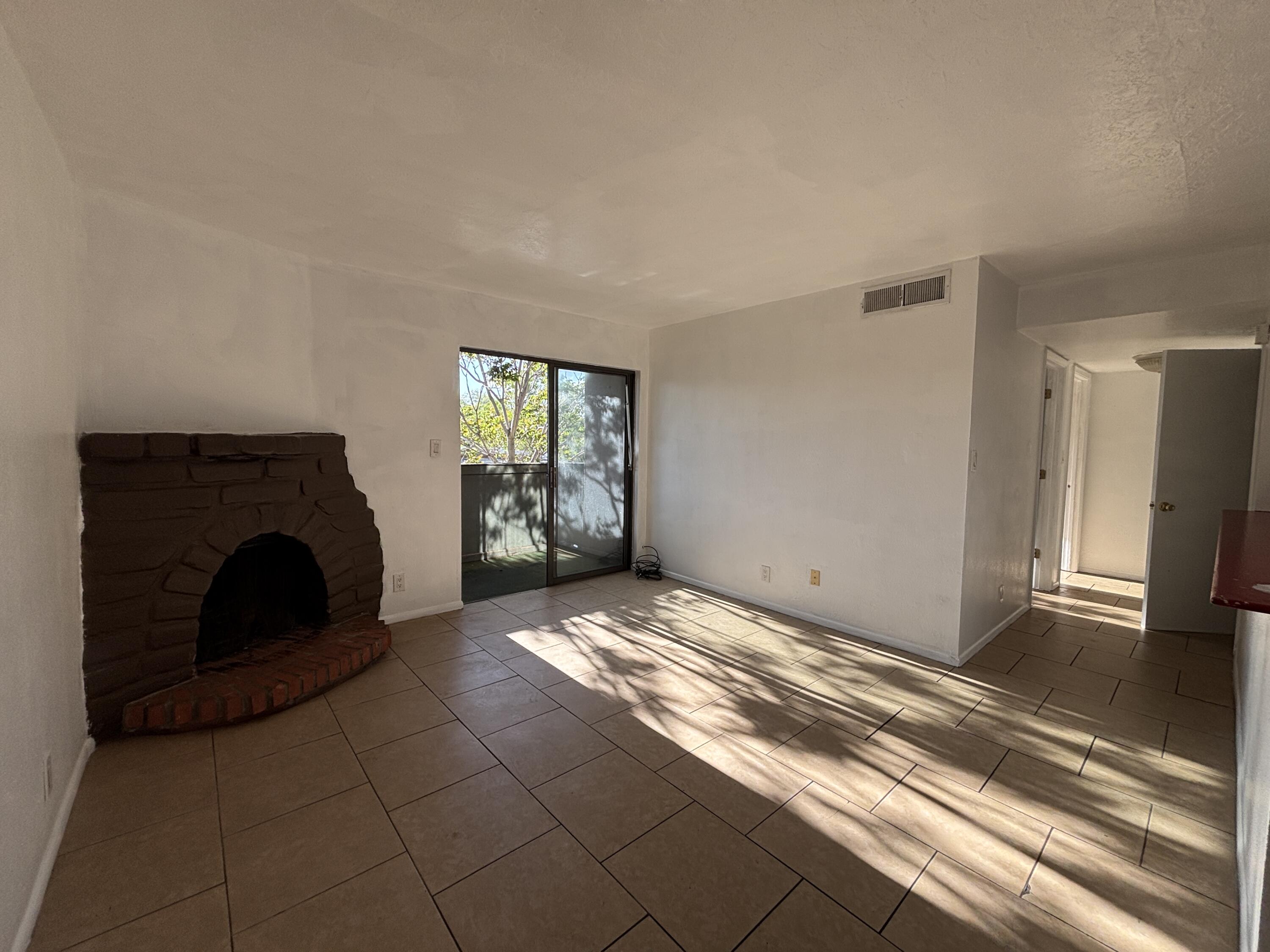 Excellent starter home! The seller will pay a year of HOA (Homeowners Association) fees. This two-bedroom, one full-bath condominium, with an open concept, is located on the second floor and is an end unit. It features a cozy kiva fireplace and a balcony. The listing price accurately reflects the home's condition and is being sold in ''AS-IS'' Condition. Home needs a little TLC.