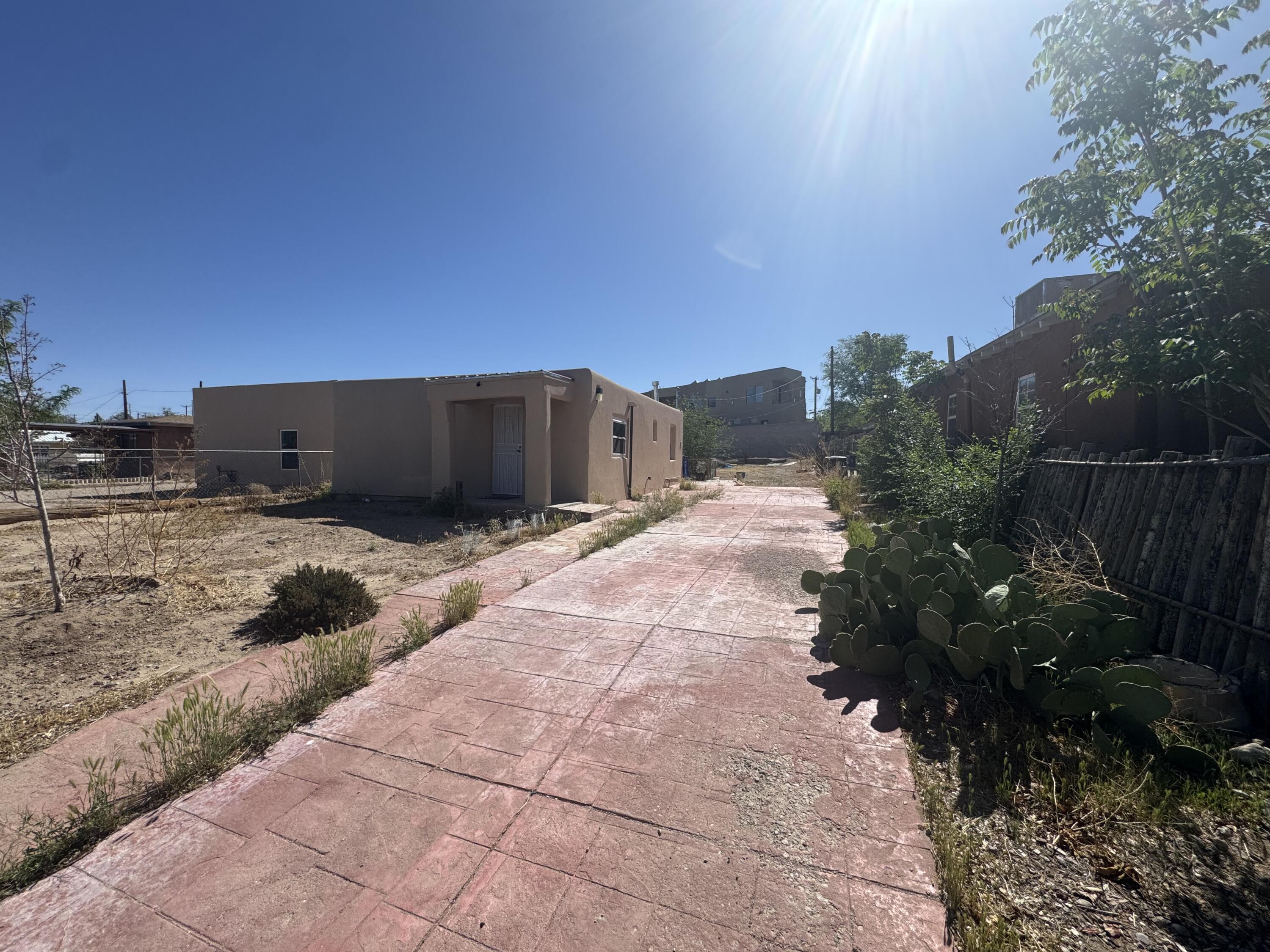 Discover charm and opportunity with this 2-bedroom, 1-bathroom home situated on a spacious lot just minutes from downtown Albuquerque. Offering a cozy, inviting layout, this property is full of potential -- whether you're looking for a prime investment, a rental property, or a personal residence with room to expand. The oversized lot provides endless possibilities for future additions, outdoor living, or redevelopment. Enjoy easy access to shops, dining, entertainment, and major routes while benefiting from the quiet feel of a well-established neighborhood. A rare find in a fast-growing area!