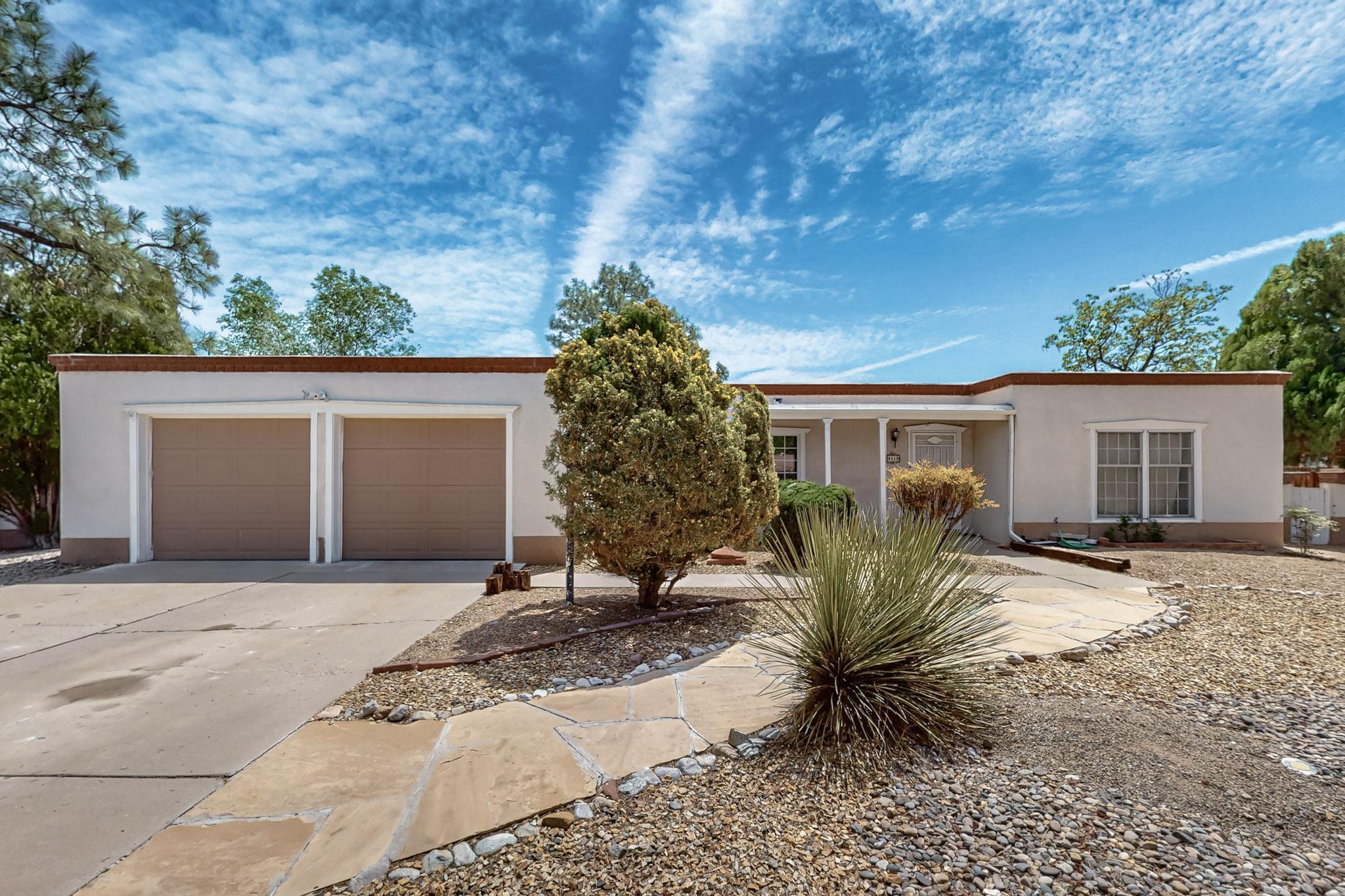 Serene North Valley Retreat with Acequia Access! Embrace the tranquility of this beautiful North Valley home, nestled in the quiet & executive Dietz Acres neighborhood. This charming 3-bedroom, 2.5 bathroom backs onto picturesque, shaded acequias offering a natural and peaceful setting. Enjoy the nearby lush open space and proximity to the Bosque bike trail, perfect for outdoor enthusiasts. Located on a serene cul-de-sac in a high-end community, this home combines the best of nature and luxury living. Just 0.2 miles (1 min bike ride) from the popular Flying Star Cafe, it offers both convenience and an idyllic lifestyle. Inside, you'll find soaring beamed ceilings, 3 livings areas, a gourmet kitchen with modern appliances, and large windows that fill the space with natural light.