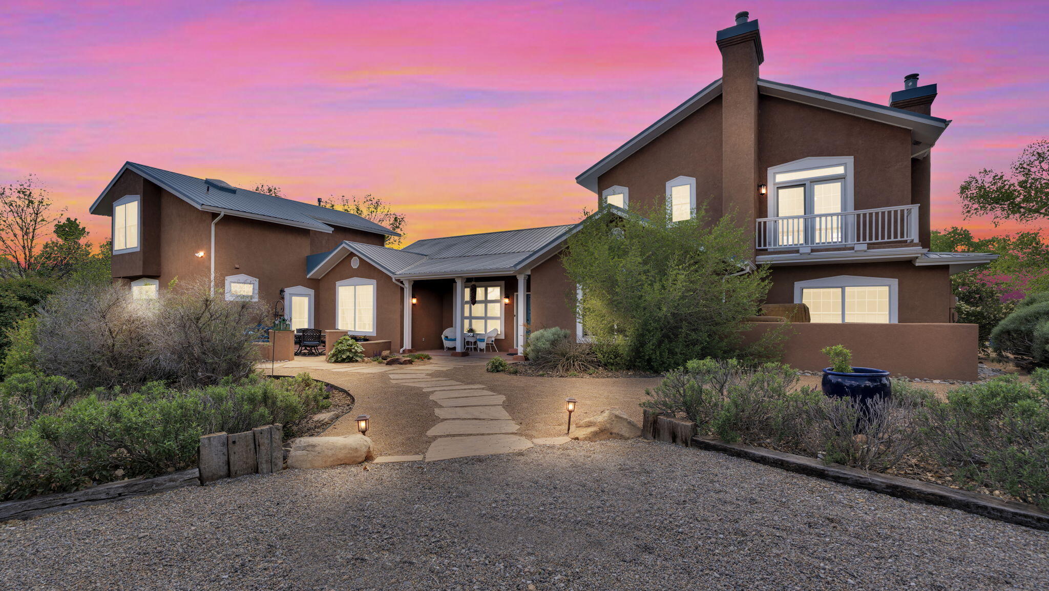 Nestled in Albuquerque's serene South Valley, this exceptional gated fenced property offers a harmonious blend of spacious living and equestrian charm. Set on a generous 1.72 acre irrigated lot, the 4500 square-foot residence boasts 4 bedrooms, 3 bathrooms, and an office/library providing ample space for comfortable living with potential for horses and livestock. The home's floorplan could easily accommodate an in-law suite offering independent living for extended family or guests.  The custom built home filled with natural light reflects thoughtful design and enduring quality. Its expansive layout caters to both everyday living and entertaining, while the beautifully landscaped surroundings offer picturesque views and a tranquil ambience. Amenities include cozy fireplaces ideal