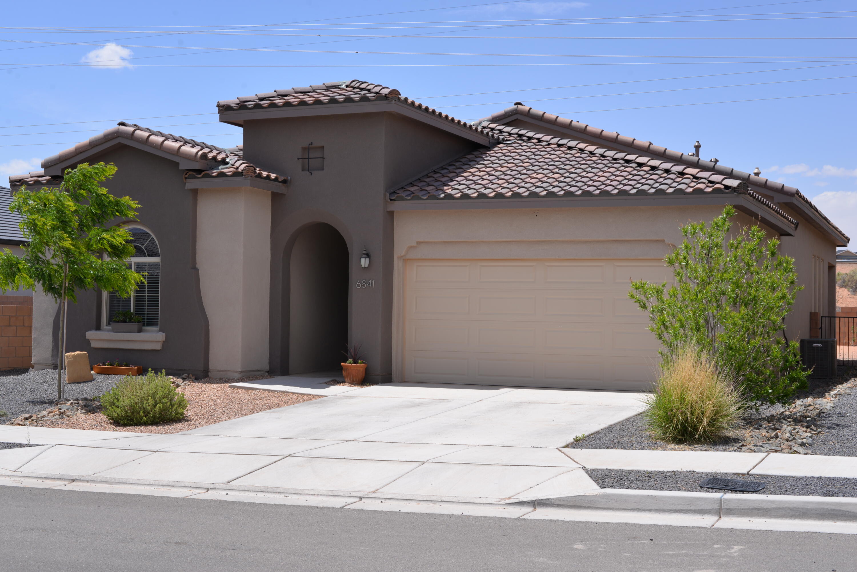 Enjoy life in the stylish comfort of this Lomas Encantadas home, priced to sell at only $215/SF, with PID paid in full. Constructed in 2022 and meticulously maintained,  its neutral finishes can accommodate many decorating styles.  High ceilings in living/dining area with gas fireplace.  Tiled living areas and premium carpet in the bedrooms.  Large kitchen island with granite countertops throughout.  Separated primary suite, with extra large walk-in closet.  Laundry room, generous 2-car garage and flex 4th BR/study.  Arroyo to the west gives space from neighbors.  Located on the north end of Rio Rancho, the neighborhood offers quick access to NM-550 and I-25, for an easy commute to Albuquerque, or north to Santa Fe and Los Alamos.  Don't wait, this lovely home is priced to sell