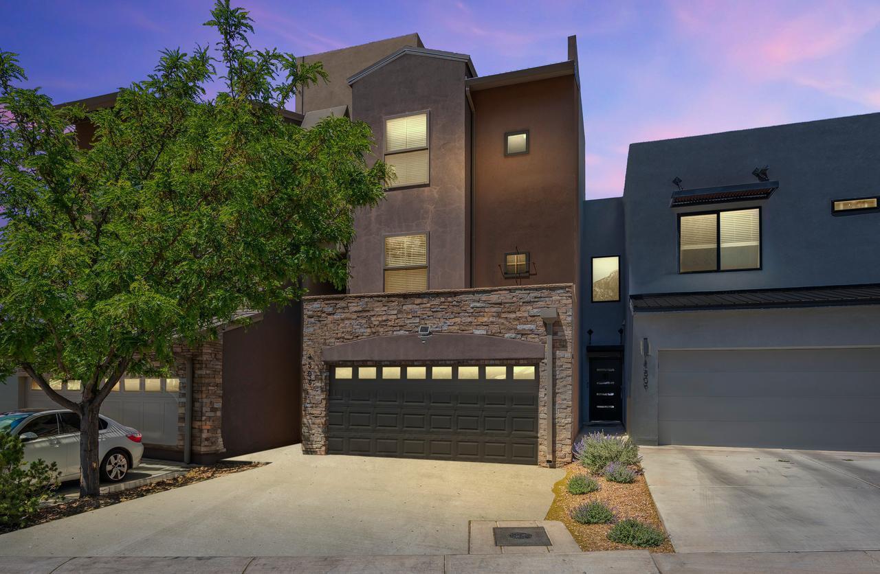 Experience elevated living--literally--in this architecturally unique NE Heights home, featuring a rare custom residential elevator that adds both convenience and flair. The modern kitchen is equipped with stainless steel appliances, granite countertops, and elegant tile finishes. Spacious living space with new carpet, and a cozy fireplace. Owners suite with private spa-like bath. Relax in the soaker tub and the large walk-in shower! Sky decks and a private balcony, ideal for enjoying New Mexico's stunning outdoors.