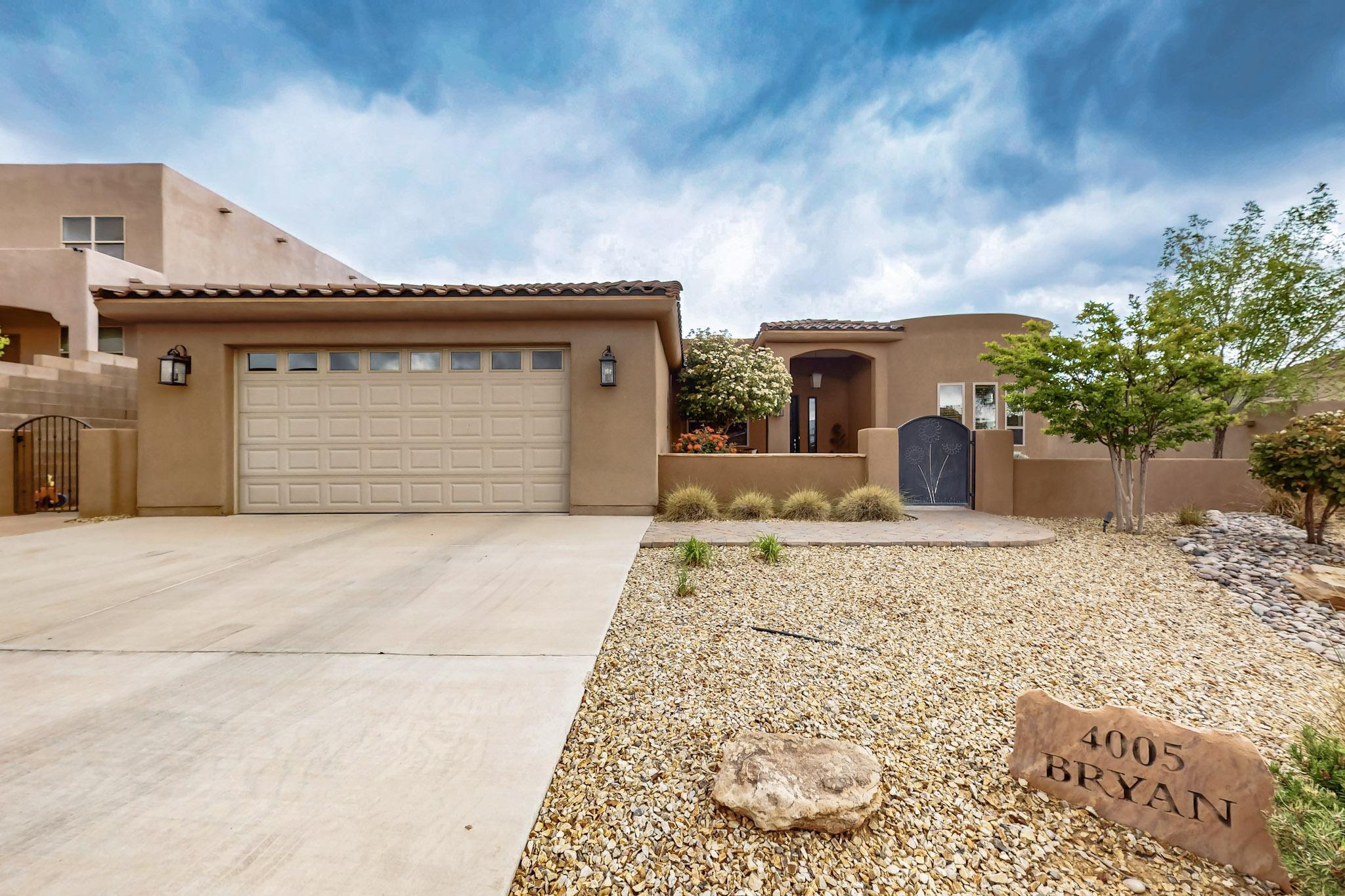 Experience a unique blend of luxury and comfort in this exquisite one-owner single-story home with stunning mountain and city views in a desirable NW location! This home features 4 bedrooms, 2 bathrooms, wood floors, and a custom fireplace. The gourmet kitchen includes custom cabinets, granite counters, a stylish backsplash, and a spacious island. High ceilings and skylights provide abundant natural light. Enjoy a gated front courtyard with a waterfall and a backyard retreat featuring professional landscaping, a rock waterfall, built-in BBQ, and covered patio with plenty of space to entertain friends and family! Unobstructed views of the city and mountains! Conveniently located near restaurants, breweries, biking trails, and shopping. No HOA. This home is a must see!