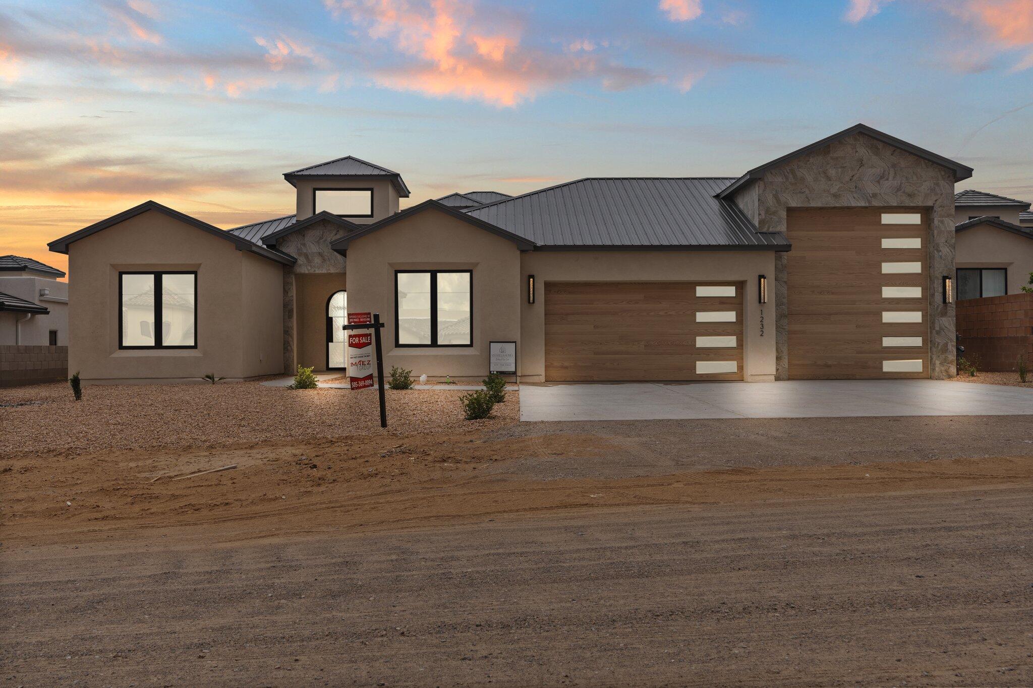 An exquisite Vistabella masterpiece, crafted with luxury and sophistication by renowned designer Ron Montoya, and gracefully nestled among custom homes in Rio Rancho!  Featuring 3,246sf,  4 bedrooms, 3.5 bathrooms, and an oversized RV garage, this home blends elegance and functionality. Beautifully designed living space with wood floors, a fireplace with a stunning marble surround.  The chef's kitchen is a true showpiece, featuring sleek designer cabinetry, quartz countertops, high-end appliances, hand crafted range hood, and a generous waterfall island ideal for entertaining.  Well-appointed butler's pantry! Owner's suite offers a tranquil retreat with a tray ceiling enhanced by ambient lighting and a private spa-like bath. Entertain on your expansive covered patio or party deck!