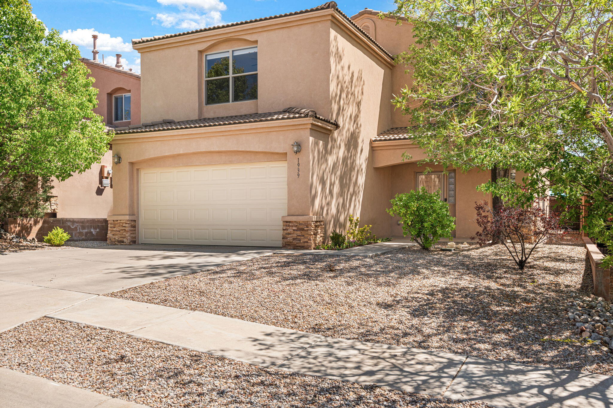 Spacious & impeccably maintained, this beauty offers the perfect blend of comfort, functionality & style! NO PID. Excellent location near local amenities & convenient access to KAFB. Open flrplan, 2 liv areas, formal dining, bright kitchen w/elegant white cabinetry w/glass inserts, sleek counters, & newer fridge. Laminate flrs & plantation shutters on main level, updated lighting, ceiling fans in all bdrms, carpet on 2nd level replaced 2020, ref air w/multi units, hot water heater replaced 2020, expoxy floors in finished garage w/newer garage door. Large loft perfect for an office/media rm/play rm. Huge primary w/built-in shelves, walk-in closet & en suite w/garden tub, sep shower & double sinks. Lush landscaping in back w/paver patio perfect for outdoor dining. This home is a Must See!