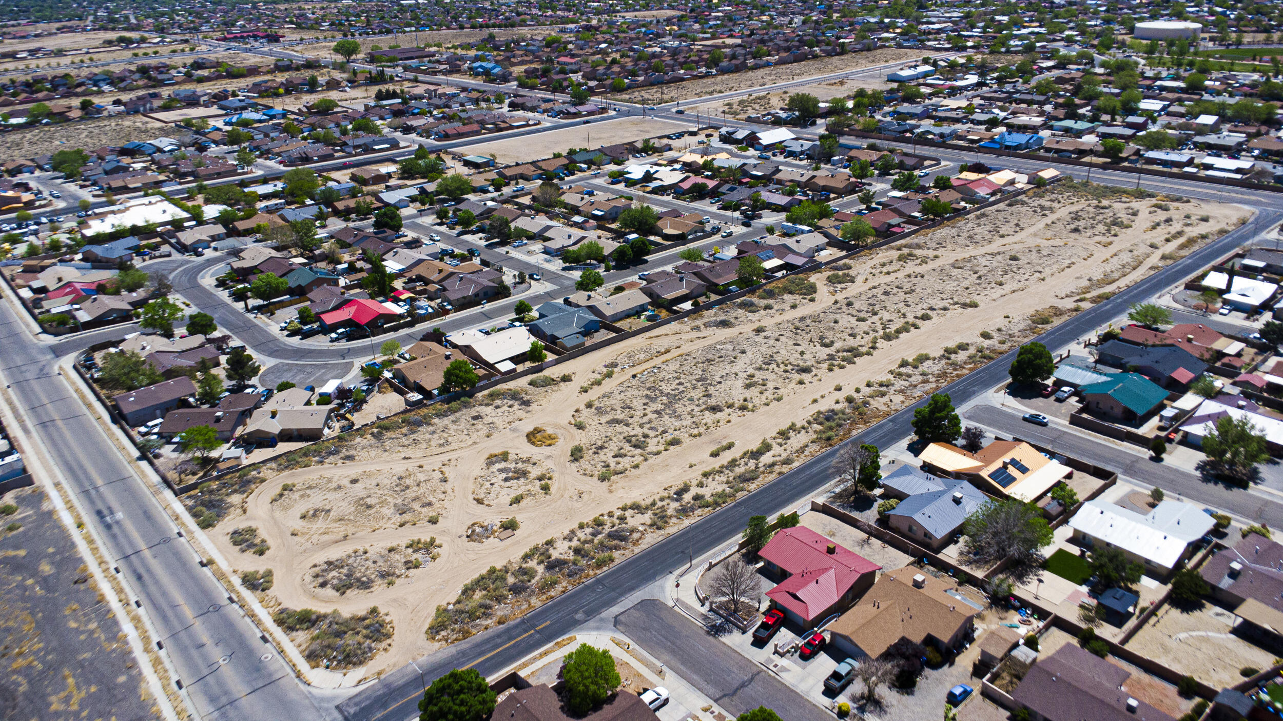 Presenting 5 acres of development-ready land, comprised of five individually plotted lots, located at the intersection of Sage Rd and 90th St. This level site is fully equipped with utilities at the street offering a seamless path toward construction and development.Zoned R-T (Residential - Townhouse), the property is ideally suited for apartment complexes, townhouses, or other high-demand residential projects.Located in Albuquerque's rapidly expanding southwest corridor, this area is widely recognized as an underserved rental market, where demand continues to outpace supply. With steady population growth and limited available rental housing, this site presents a rare chance to capitalize on the strong need for quality housing in this emerging market.