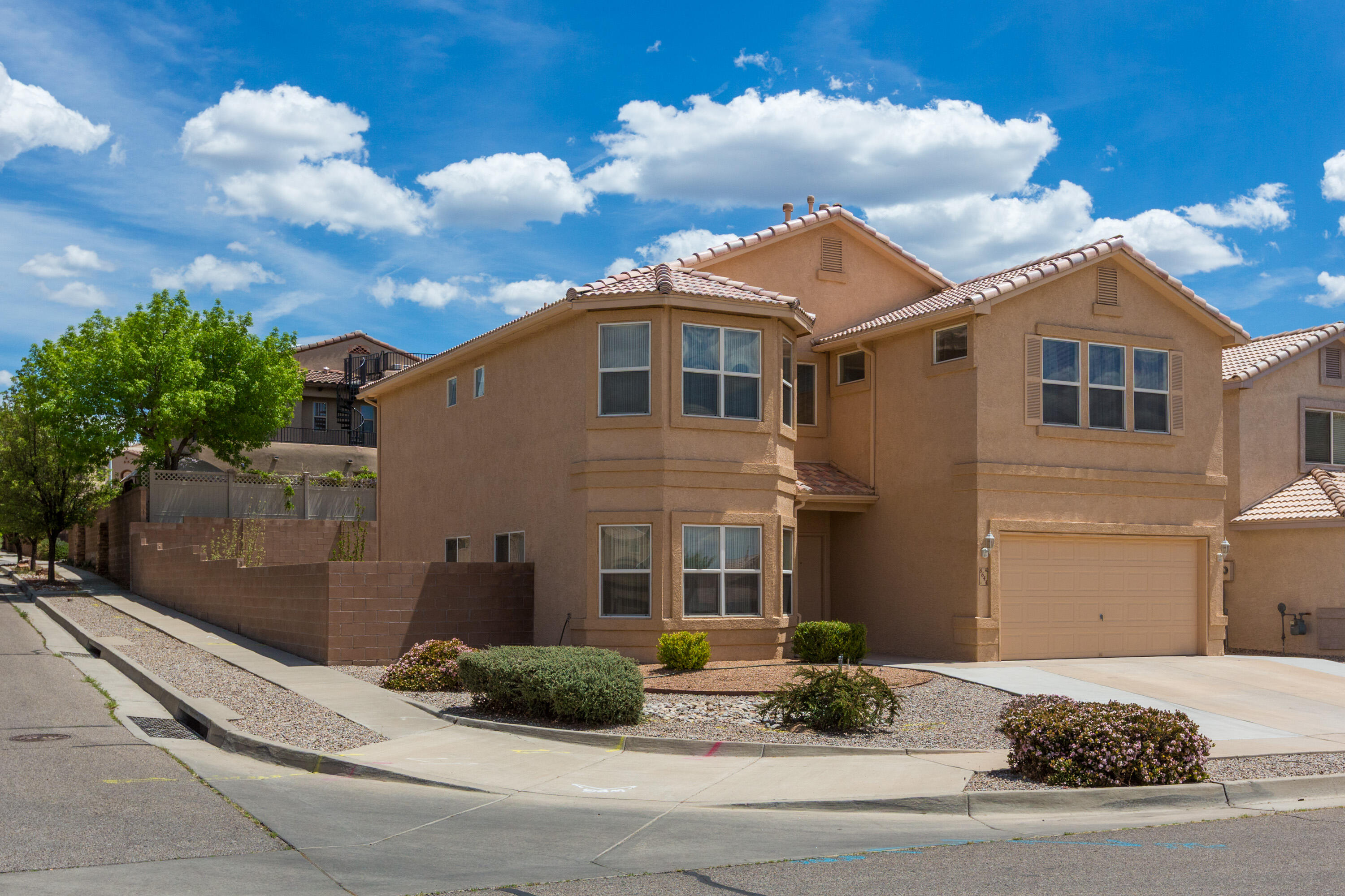 Welcome to this beautifully maintained two-story home located in one of Albuquerque's most sought-after neighborhoods! Boasting 4 bedrooms, 3 full bathrooms, and over 2,800 sq ft of living space, this home offers comfort, functionality, and an ideal layout for both everyday living and entertaining. Inside you'll discover two spacious living areas, perfect for relaxing or hosting guests, along with a cozy gas fireplace adding warmth and charm. The open-concept kitchen and dining area. Upstairs, you'll find a versatile loft space, along with generously sized bedrooms, including a spacious primary suite with sunset views, a private bath and large closet. Conveniently located near top-rated schools, shopping centers, and popula