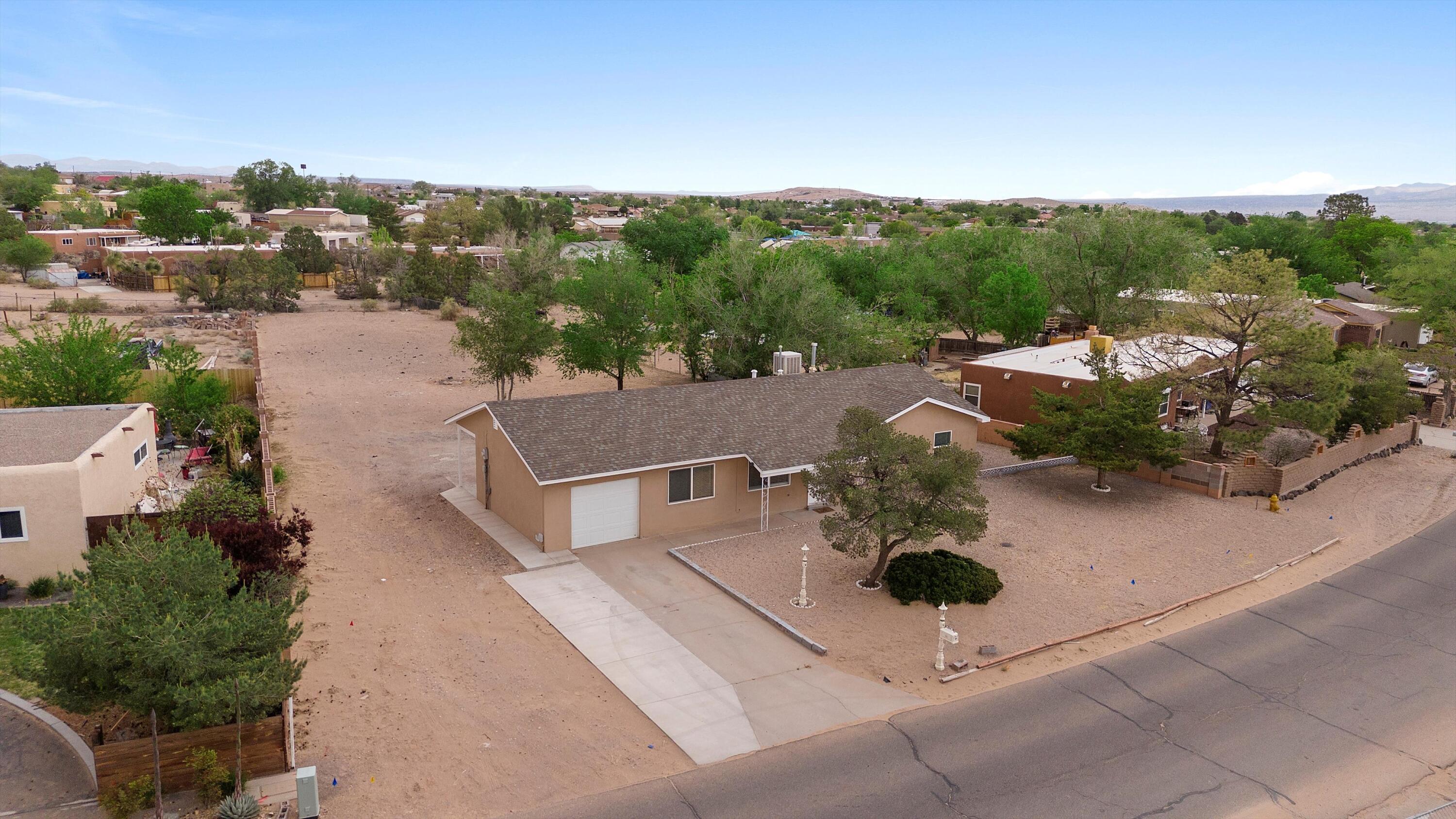 Big price improvement at 224 2nd Street SE in Rio Rancho! Conveniently located just a minute west of Unser Blvd., this beautifully updated property offers easy access for commuters. Situated on a spacious half-acre lot, the nearly level terrain provides excellent backyard access and ample parking, including a generous side driveway. Since 2018, the owner has completed an extensive renovation--everything from the roof and flooring to the stucco and windows has been upgraded. The kitchen and bathrooms have also been tastefully modernized, and the septic tank was recently replaced. A full list of upgrades is available in the MLS. Don't miss this incredible opportunity--contact your Realtor today!