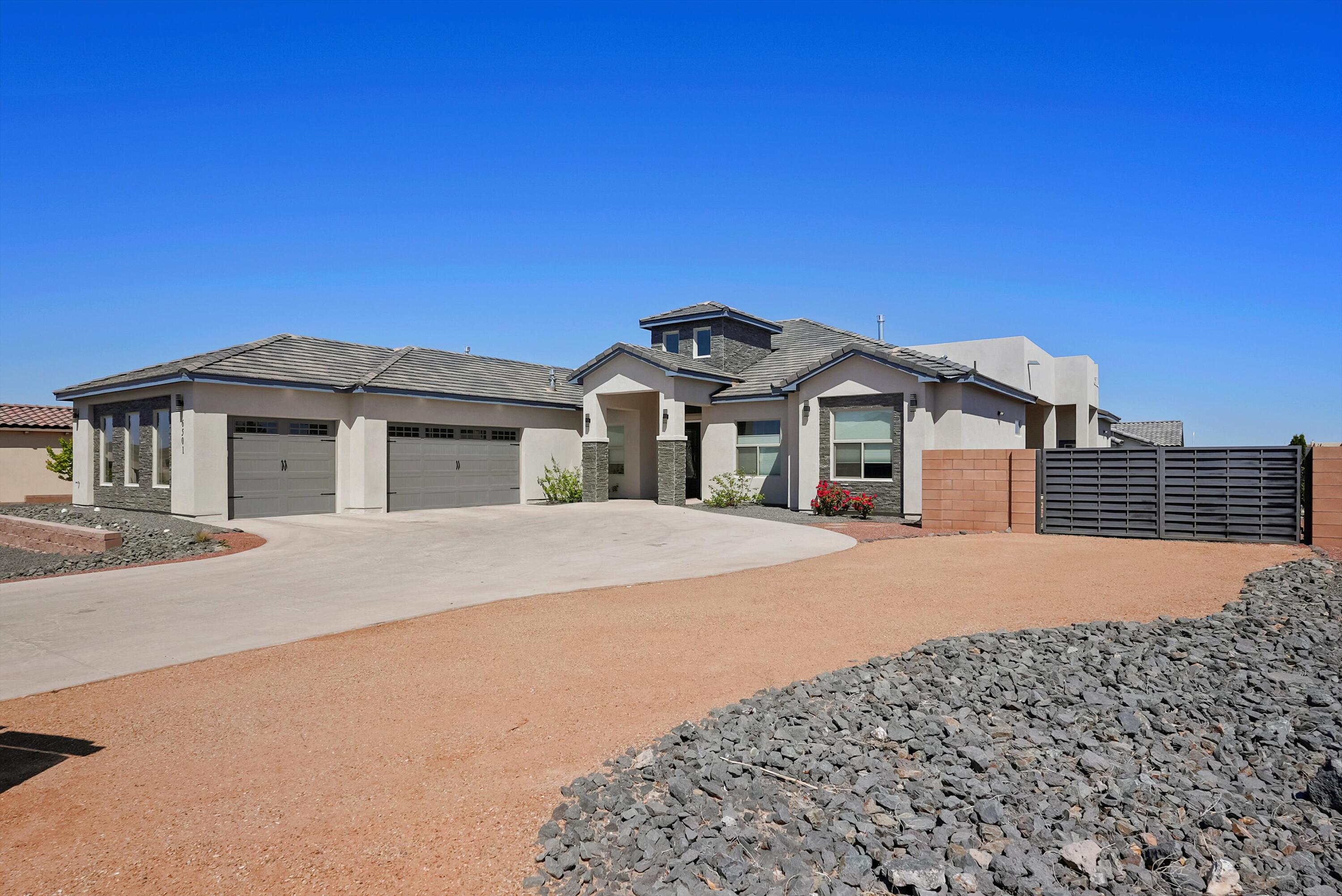 WELCOME TO OVER 4000 SF OF LUXURY IN VIBRANT NW ABQ! Located in Volcano Cliffs, this custom home sits on a generous corner lot in Petroglyph Estates, where sweeping views of the Bosque, city lights, and the Sandias greet you daily. Feel the spaciousness--from soaring tray ceilings to 2 living areas that invite both relaxation and connection. The chef's kitchen is a dream, with huge island, sleek appliances, and built-in cooktop. Pour your morning coffee at the wet bar before settling into the sunny office or unwinding by a custom fireplace. The primary suite is a retreat of its own with double vanities, rain shower, and walk-in closet. Fully xeriscaped yard, vehicle access, and covered porch--perfect for New Mexico evenings. Call today to see it for yourself!