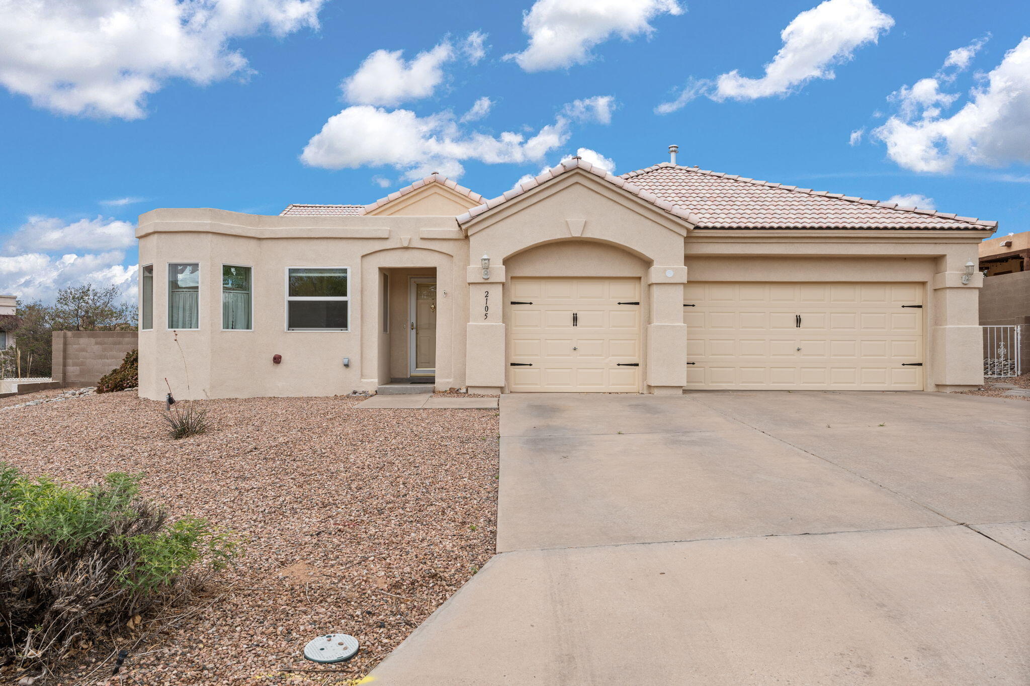 Spacious home on a large lot in a lovely custom neighborhood located in Rivers Edge II with Mountain Views! One level, 4 bedroom, 3 car garage! Very generous living spaces with an open feel. Kitchen has plenty of cabinet/ counter space along with a large breakfast bar and pantry. Kitchen opens up to the large family room and eating area which makes it great for entertaining. Family room has a gas fireplace. Home also offers a formal dining room. The primary bedroom is separate from the other bedrooms and is very generous in size. Secondary bedrooms are large. There is a bonus room, which would work wonderfully for exercise, playroom, hobby room. Entire home recently restuccoed. Great Rio Rancho location. Quiet established neighborhood.  Close distance to the Bosque/Trails WOW!