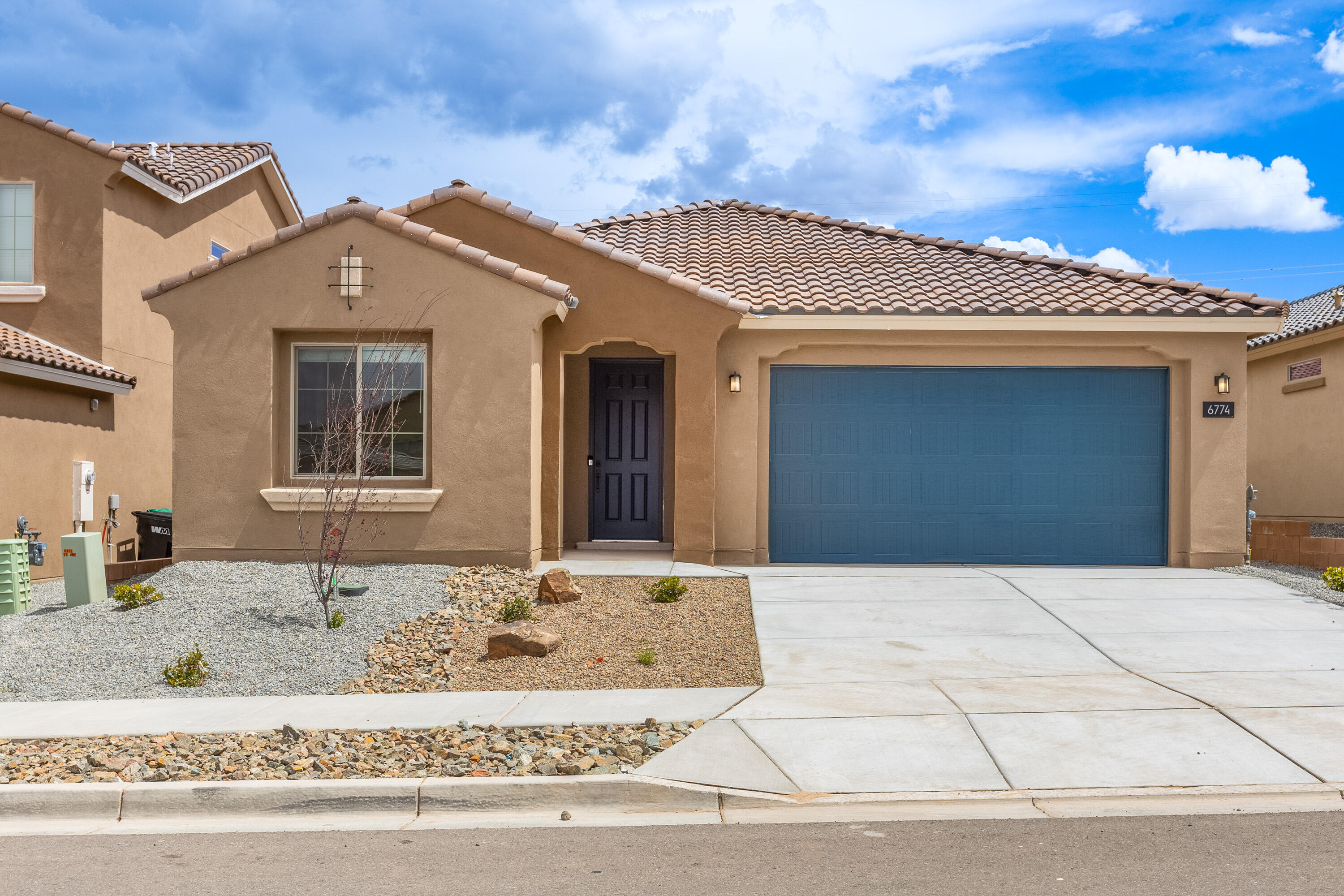Gorgeous home with white cabinets and Kitchen Aid appliances. Views of sandias from oversized patio. Beautiful vinyl faux wood planks. Beautiful kitchen with white cabinets and black quartz tops. a stunning home. Minutes from 550 and I-25 make Lomas Encantadas an easy commute anywhere. Ready Now.