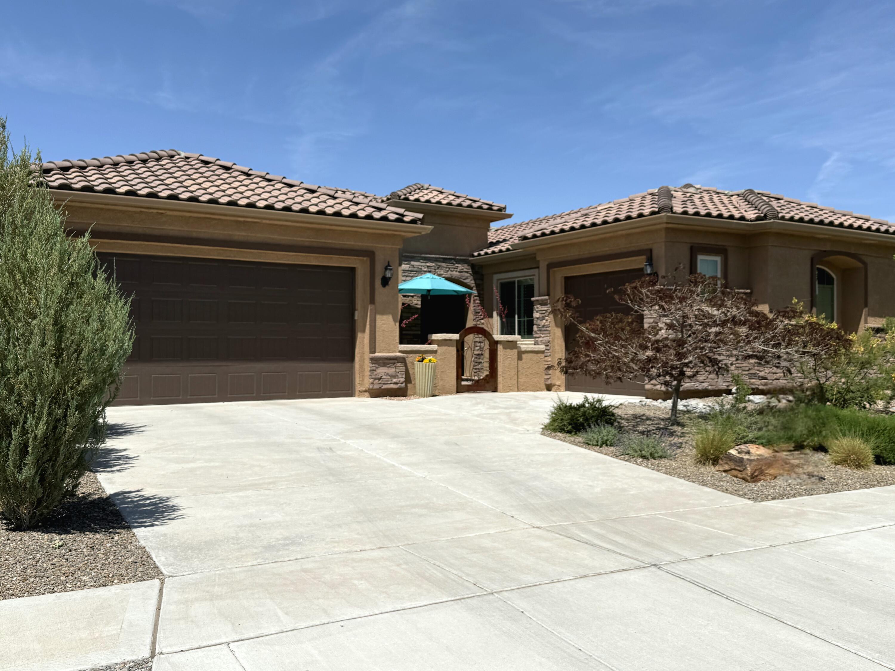 This exceptional home offers dual primary suites, perfect for privacy and flexibility, in the premier 55+ Del Webb at Mirehaven community. Enjoy tile & plank flooring (no carpet), upgraded cabinetry, a chef's kitchen with under-cabinet lighting, and all appliances included. The 3-car epoxy garage features a mounted safe and climate-controlled storage. Professionally landscaped yards include pavers, gutters, synthetic turf, art gates, fountains, kinetic sculptures, and outdoor art. The backyard is beautifully lit with hardwired landscape lights and outdoor plugs. ALL front & backyard furniture is included. Additional features: 2 California Closets with glass doors, Culligan soft water system, surround sound, outdoor speakers, a tinted storm door, and fresh 2025 paint.  Don't miss this one!