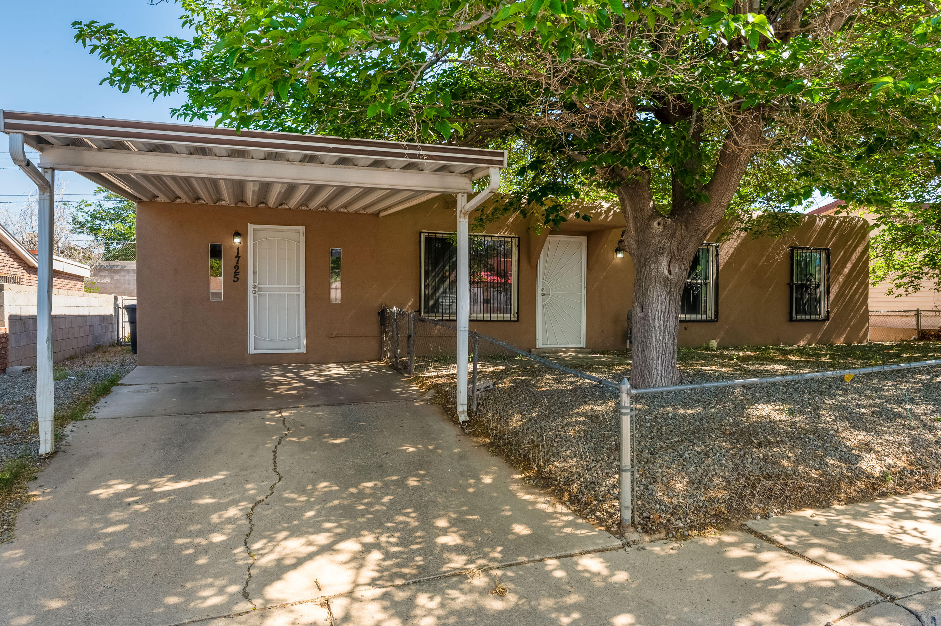 Great value home close in to UNM-CNM, nearby KAFB/Airport, Downtown, etc., and close to shopping/restaurants.  Nicely shined-up and hard to find 4BR home that has lots of elbow room.  ''Newer'' everything in this one: roof, water heater, furnace, lighting, windows, flooring, kitchen appliances.  Great opportunity to have a good-sized home that's under $200/square foot!  Perfect investment property potential abounds here, too.  Call your broker to arrange your private tour.  Available for immediate move-in!