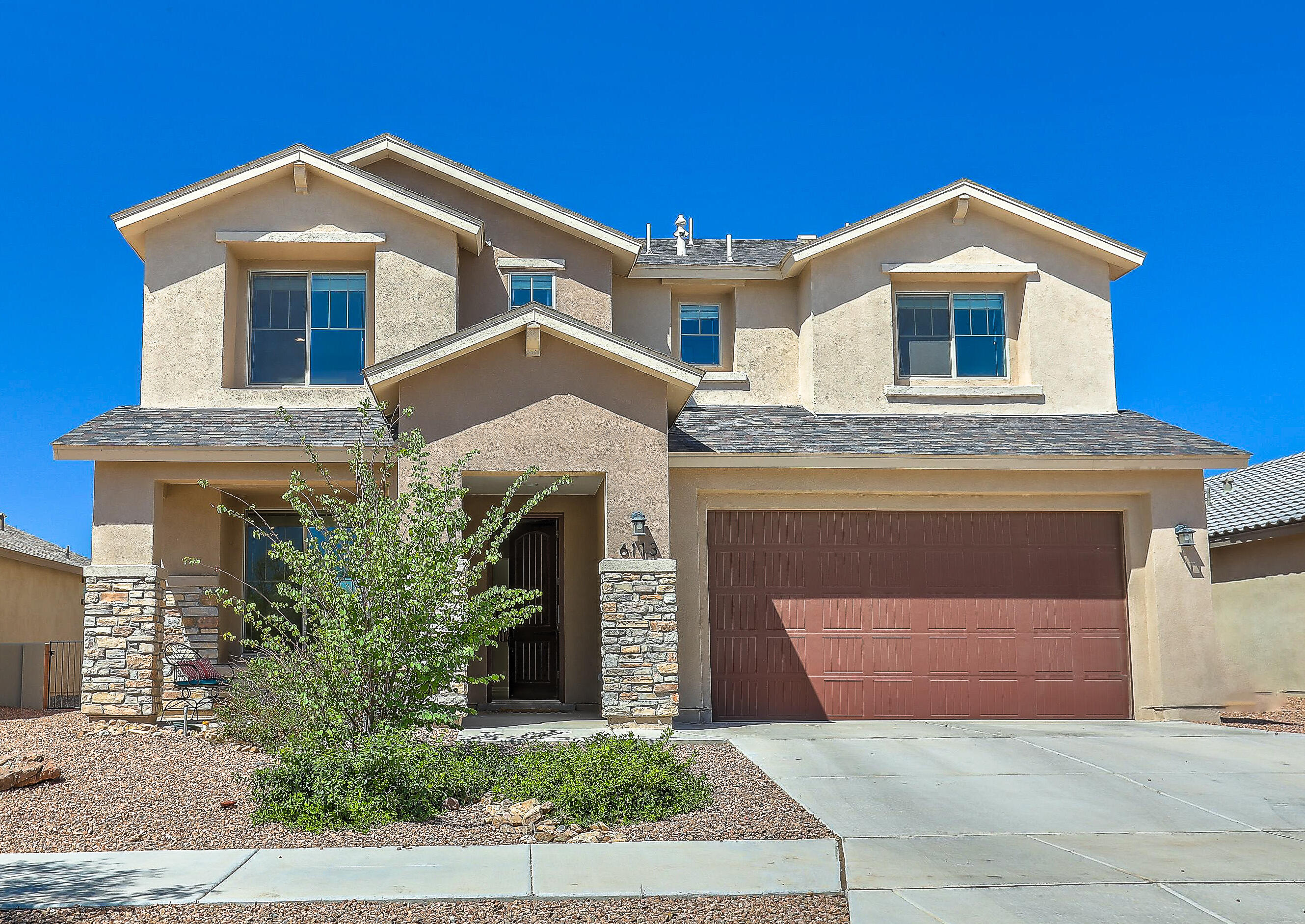 Pulte two-story home featuring the popular Monza floor plan. The spacious kitchen is equipped with stainless steel appliances, a double oven, granite countertops, and attractive birch cabinets. You'll also appreciate the large kitchen island. The great room boasts high ceilings and a gas fireplace, perfect for relaxing and entertaining. Outside, the backyard includes a covered patio and a basketball hoop. This home also offers several upgrades, such as an 8 ft tall garage door, cabinets and a counter in the upstairs laundry room, elegant 8 ft interior doors, and double sinks in both the primary bathroom and the upstairs secondary bathroom.  Community amenities include heated outdoor pool, dog park, & Sports Complex. Location is 10 miles from downtown ABQ and 12 miles from Kirkland AFB