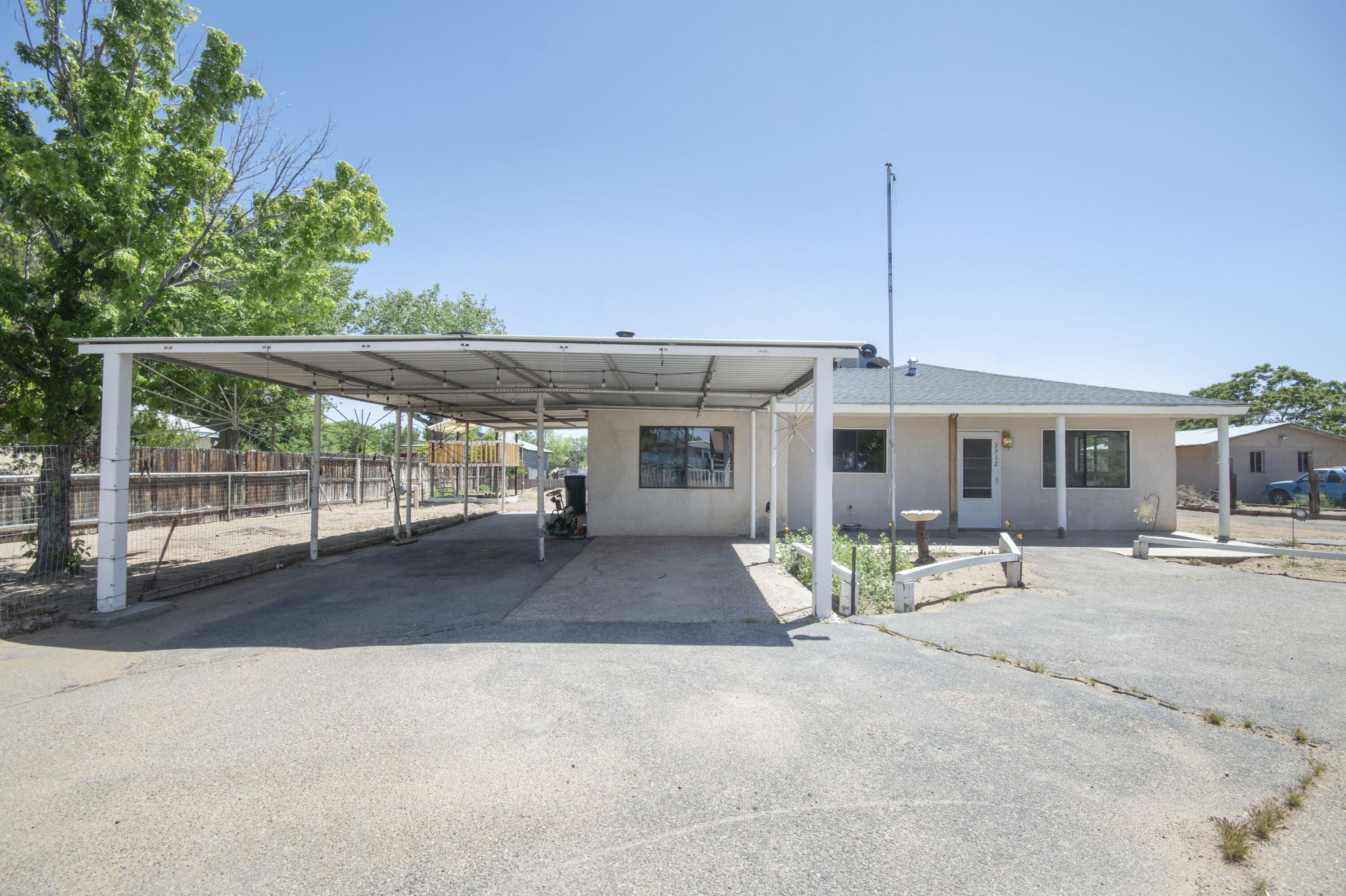 Fully fenced 1/2 acre lot. 3 bed 1 3/4  bath, large eat in kitchen, built in oven, cook top stove, overside carport for rv 24x30 workshop garage with 220 volt power, bring your horses and toys.