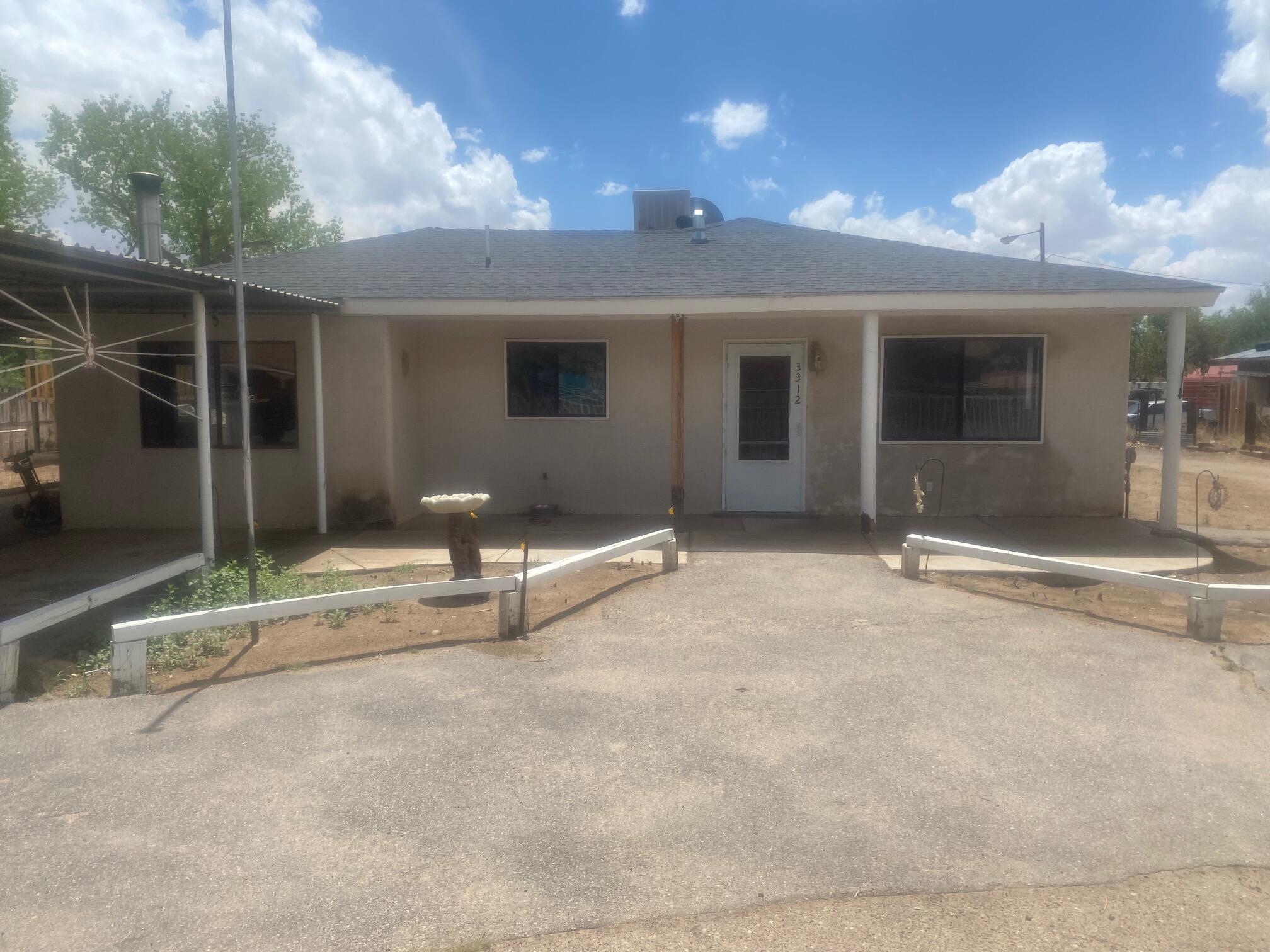 Fully fenced 1/2 acre lot. 3 bed 1 3/4  bath, large eat in kitchen, built in oven, cook top stove, overside carport for rv 24x30 workshop garage with 220 volt power, bring your horses and toys.