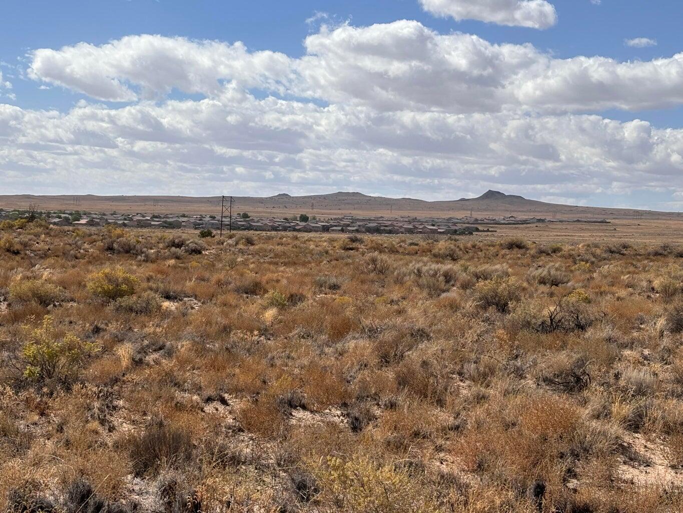 A fantastic opportunity to own land in the growing northwest Albuquerque. This prime lot offers breathtaking views of the Sandia Mountains. Lot 4 is also for sale and can be sold together.  Easy access to Paseo Del Norte and Unser Roads.  Paseo Del Norte to Kimmick Dr.  The next dirt road off of Paseo is Calle Plata.  The lot is off of Paseo Del Norte and Calle Plata, next to the new construction of Pulte Homes