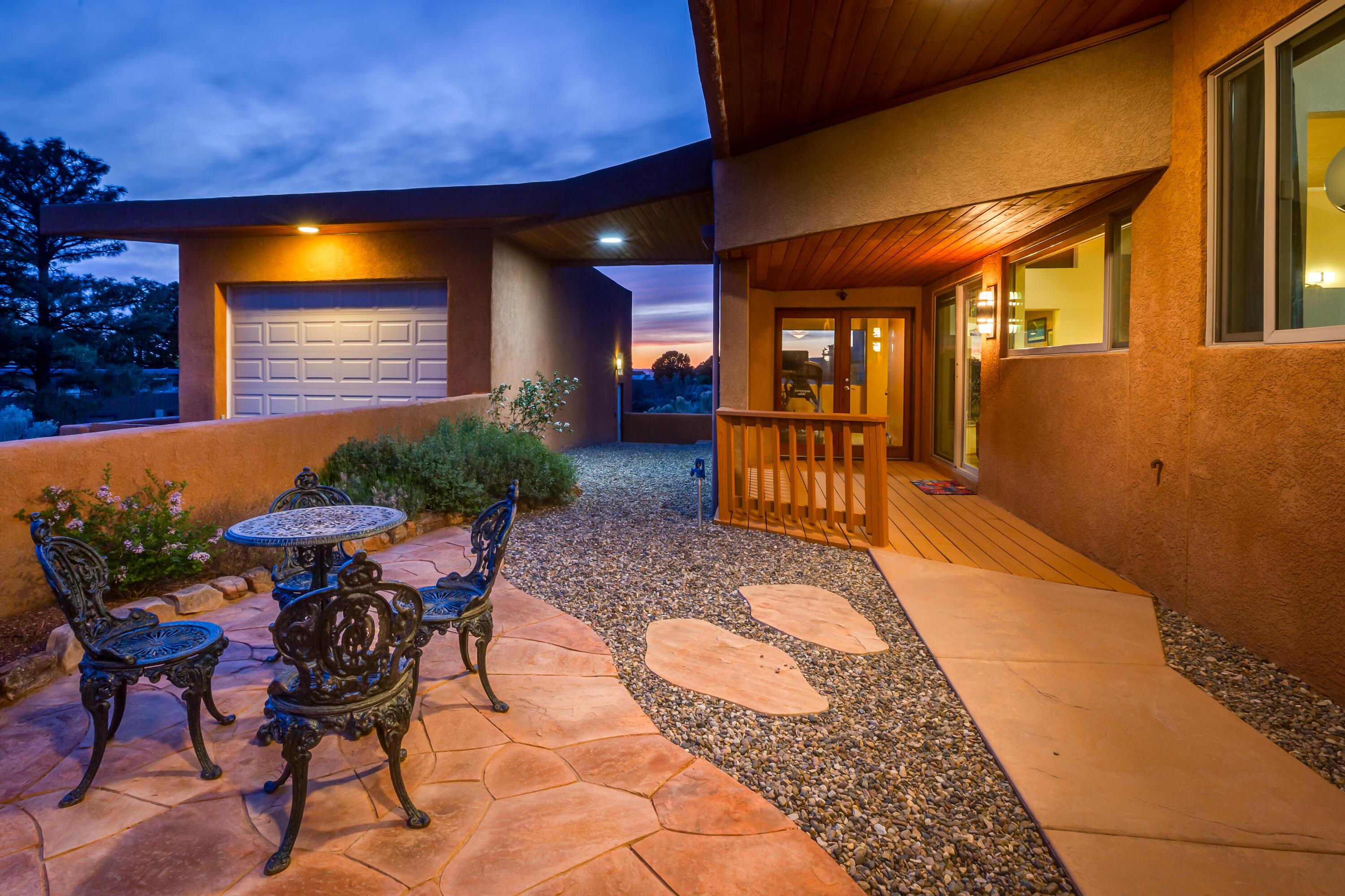Sandia Foothills living at its finest! This renovated, meticulously maintained custom home features jaw-dropping mountain or city views from nearly every room. The flowing floor plan compliments the Southwestern contemporary Revival feel. Includes two spacious living areas, formal dining, and an updated kitchen/breakfast nook with granite counters, custom cabinetry, and expansive windows viewing Sandia mountains. The outdoor space is a true oasis in the dessert with heated swimming pool, secluded hot tub, covered patio with tongue-and-groove ceiling, in-ground trampoline, and low-maintenance fruit trees, flower beds, and greenery surrounding. Removed from city lights for incredible night sky views. Oversized 2-car garage plus separate RV garage. Just minutes from trails and city amenities