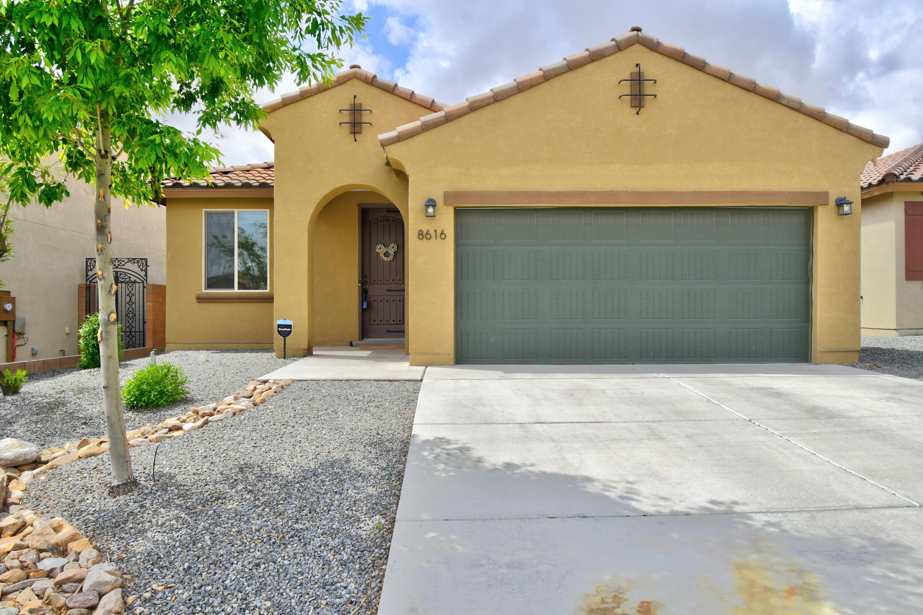 Discover your dream home in this stunning Pulte property. The gourmet kitchen boasts granite countertops & custom backsplash, paired with updated cabinets & stylish lighting throughout & the grand kitchen island has seating & overlooks a spacious living & dining area that seamlessly connects to the finished, low-maintenance backyard. Enjoy outdoor grilling while taking in spectacular New Mexico sunrises & sunsets with no neighbors behind you. The spacious primary suite is thoughtfully separated from the other rooms for added privacy. This home includes 3-4 Bds 2 full baths, & a 2-CG, all conveniently located near the Petroglyphs & nearby amenities. Easy access to I-40 & a state-of-the-art security system on the windows. This property combines comfort, convenience, & safety. Don't miss out