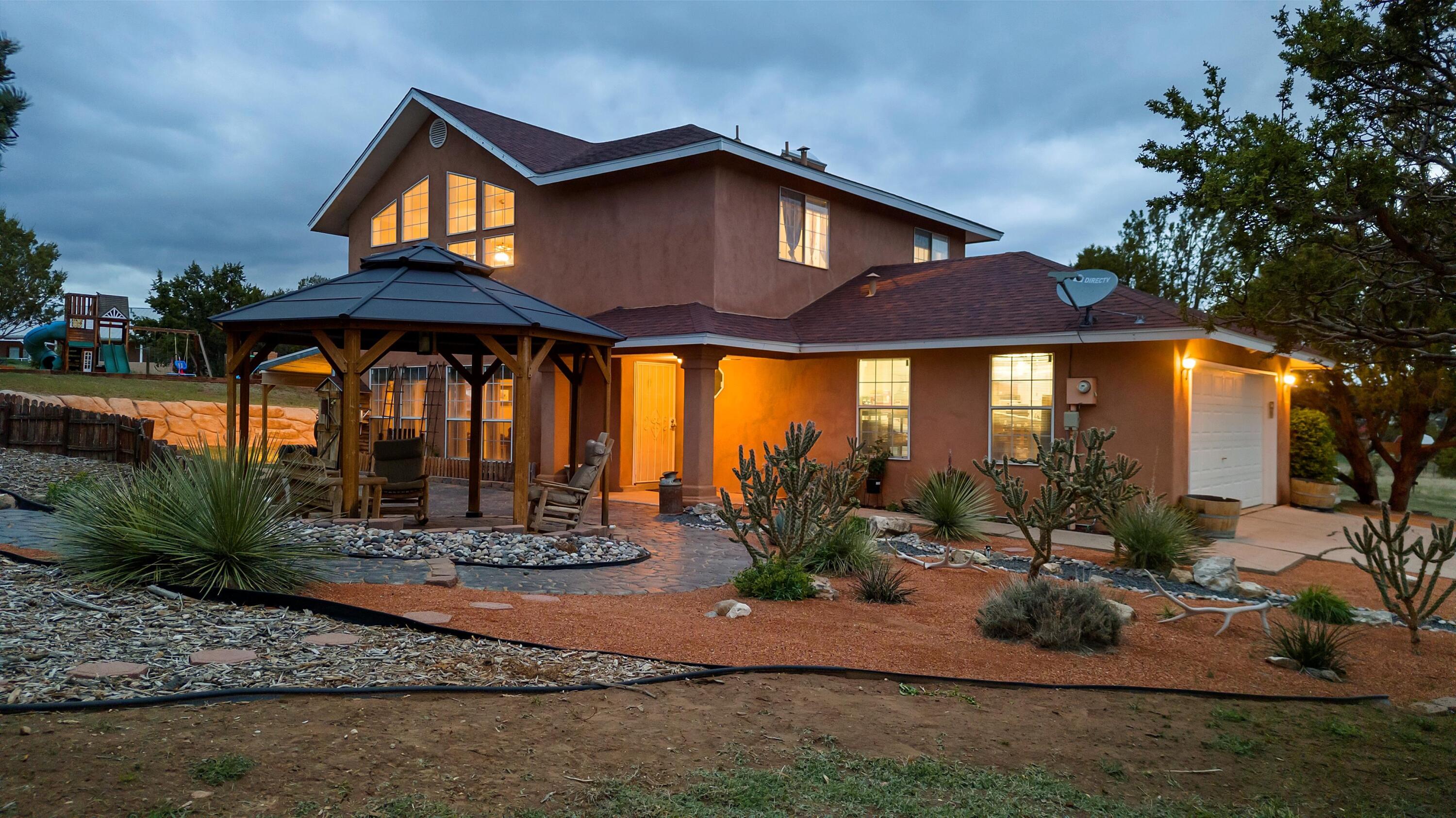 Welcome to your dream home in the country! Nestled on a quiet, no-through street, this beautifully landscaped 2-acre property offers the perfect blend of country charm and modern convenience with expansive views. Step inside the 3-bedroom, 2.5-bath, 2-story home and fall in love with the newly remodeled kitchen, featuring a walk-in pantry and stylish finishes perfect for entertaining or everyday living. Enjoy an abundance of natural light in the daytime, and cozy nights by the pellet stove under soaring cathedral ceilings, before unwinding in the spacious primary suite with his & her closets. Outside, the property is fully fenced and thoughtfully designed for both relaxation and functionality. There's plenty of room for horses and other animals with a 3-stall loafing shed with tack room,