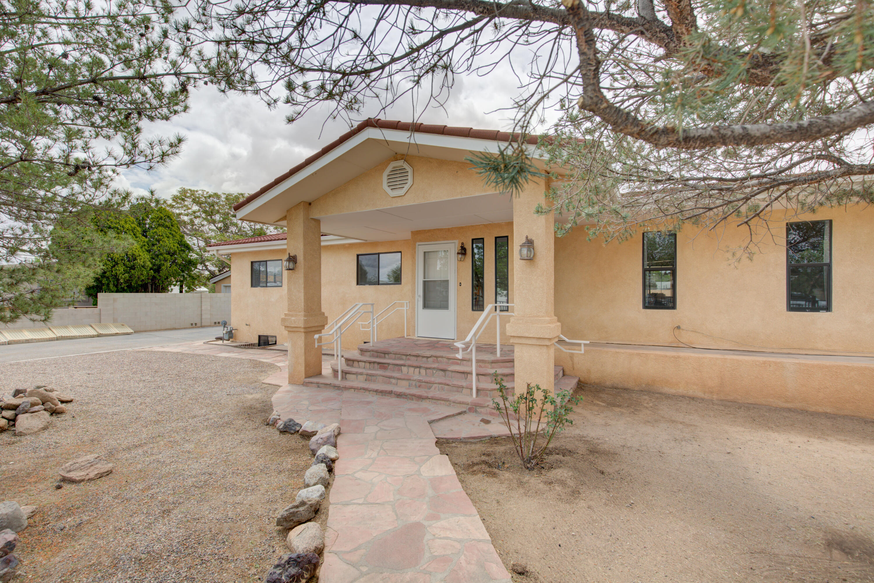 Spacious 5-bedroom, 3-bath home located on South 2nd Street in Albuquerque, NM! This well-maintained property features fresh paint and new carpet throughout, creating a clean and inviting interior. The finished basement includes a large rec room, 2 bedrooms, and a bonus room that could be used as wine storage or safe room. Enjoy the convenience of a 1-car garage with an attached workshop area, perfect for hobbies or extra storage. The backyard boasts brand-new turf, offering low-maintenance outdoor living, and a Large covered patio area for entertaining ora place to unwind and relax. With generous living space and versatile rooms, this home is ready to meet all your needs!